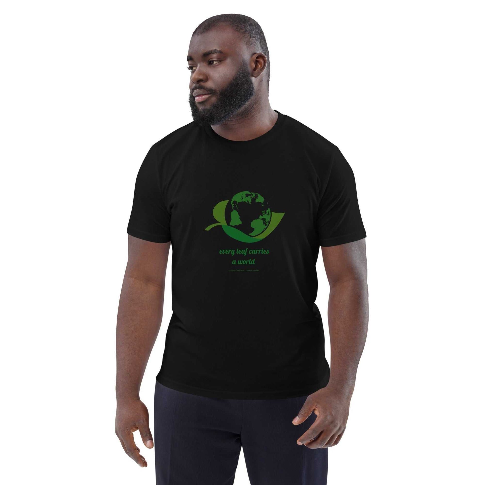 Unisex Organic Cotton Nature T-Shirt in black with green earth and leaf design and 'Every Leaf Carries a World' slogan, eco-friendly fashion.