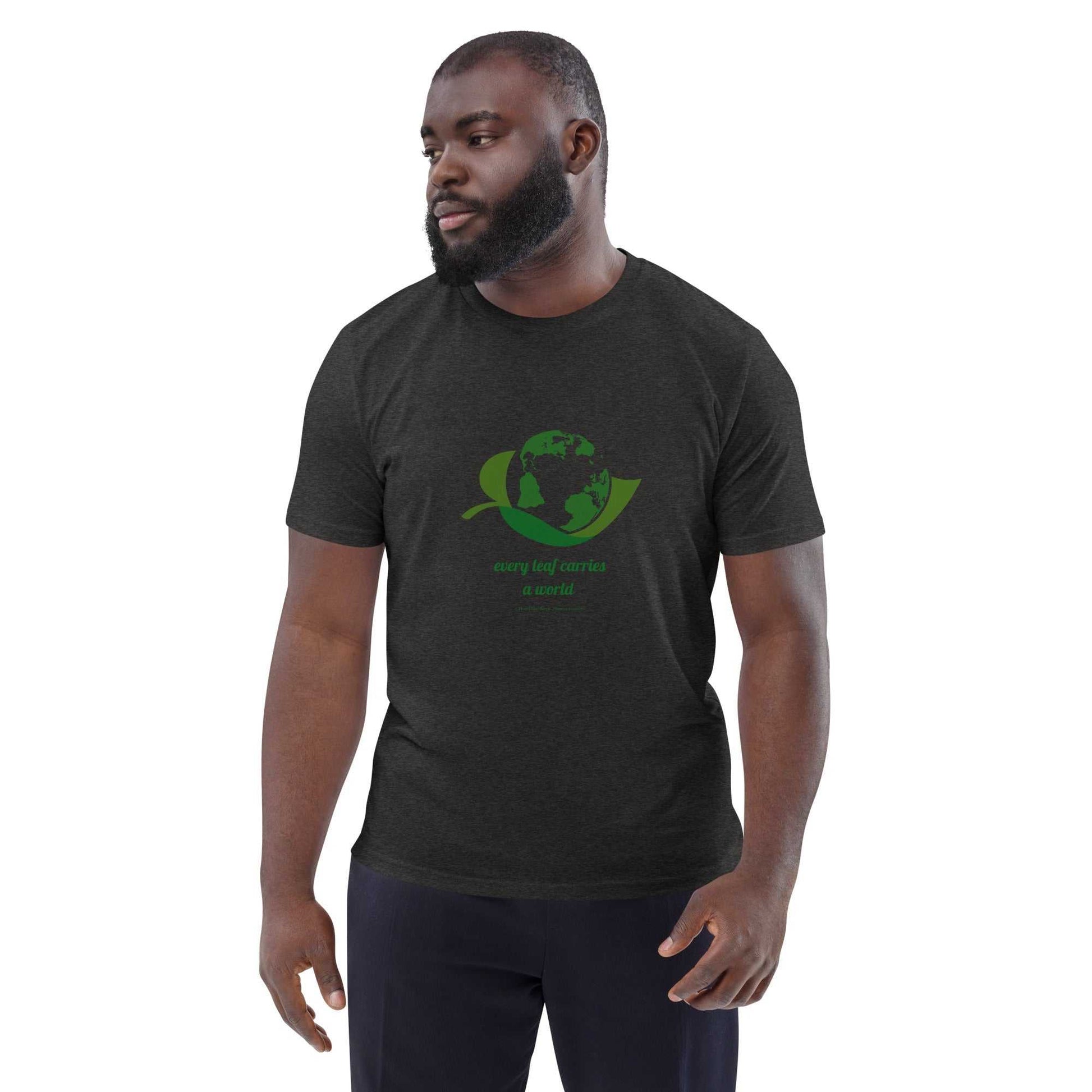 Model wearing dark heather Organic Cotton Nature T-Shirt with green globe and leaf design, promoting eco-conscious fashion.