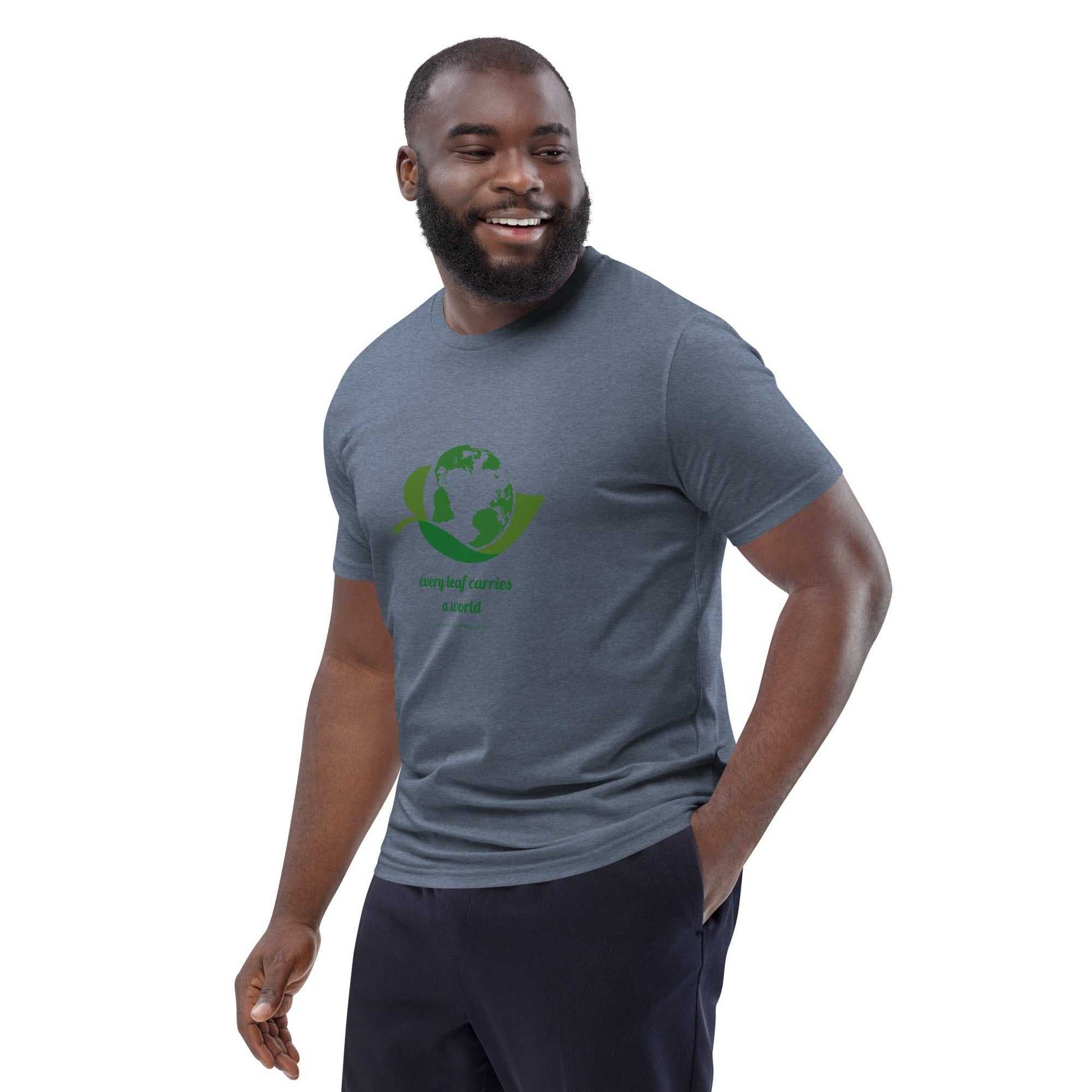 Sustainable Organic Cotton Nature T-Shirt in dark heather gray with green Earth-leaf print and 'Every Leaf Carries a World' text, unisex casual wear.