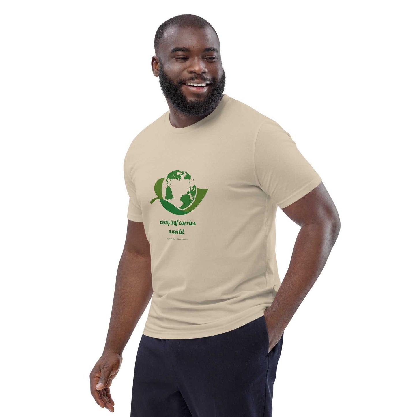 Eco-conscious beige Organic Cotton T-Shirt with green globe and leaf print, promoting sustainability with 'Every Leaf Carries a World' slogan.