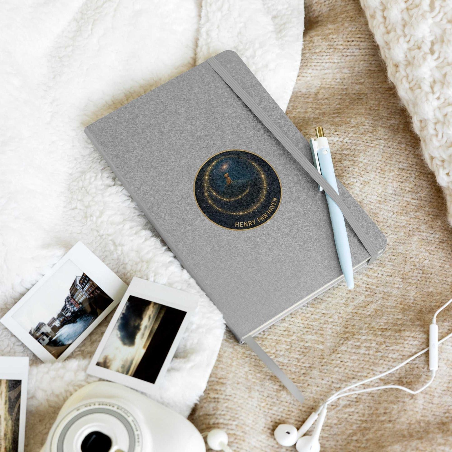 Gray Hardcover Bound Notebook 5.5" × 8.5" with 80 lined pages and HenryPawHaven logo, placed on soft blanket with writing tools.