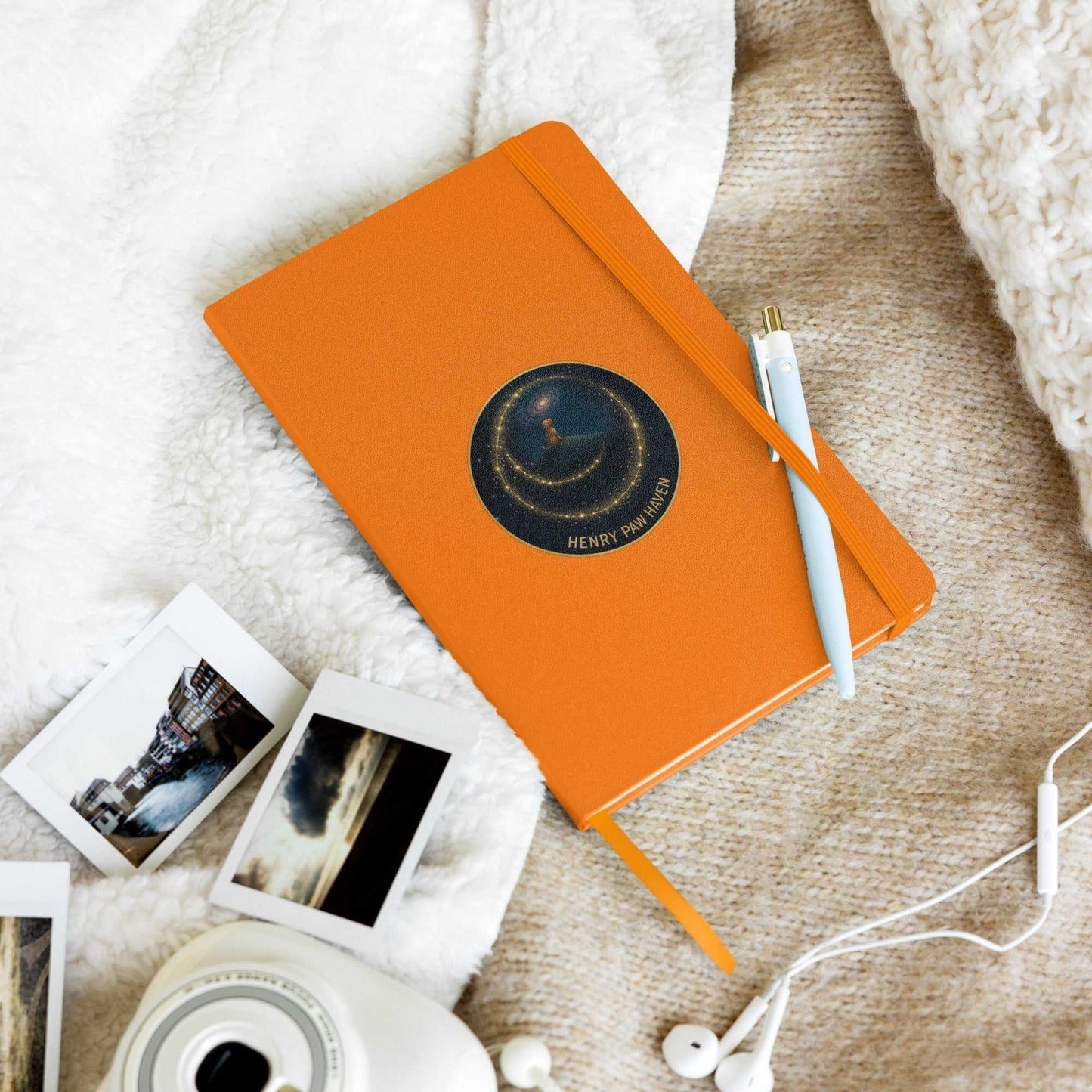 Orange Hardcover Bound Notebook 5.5" × 8.5" with 80 lined pages and HenryPawHaven logo, styled with pen and instant camera photos.