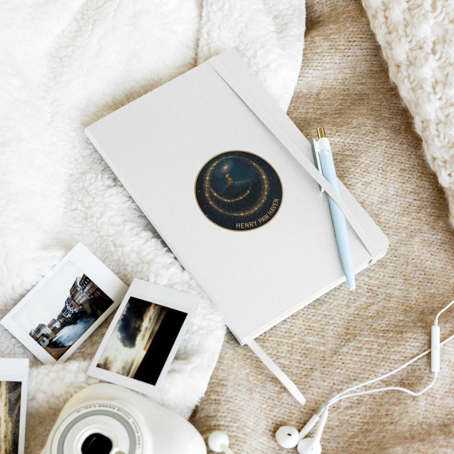 White Hardcover Bound Notebook 5.5" × 8.5" with 80 lined pages and HenryPawHaven logo, styled with pen and cozy workspace items.