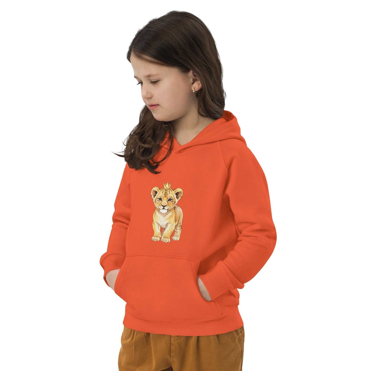 Child in orange Kids Eco Hoodie with baby lion design, hands in pocket, perfect for cozy, sustainable kids' fashion.