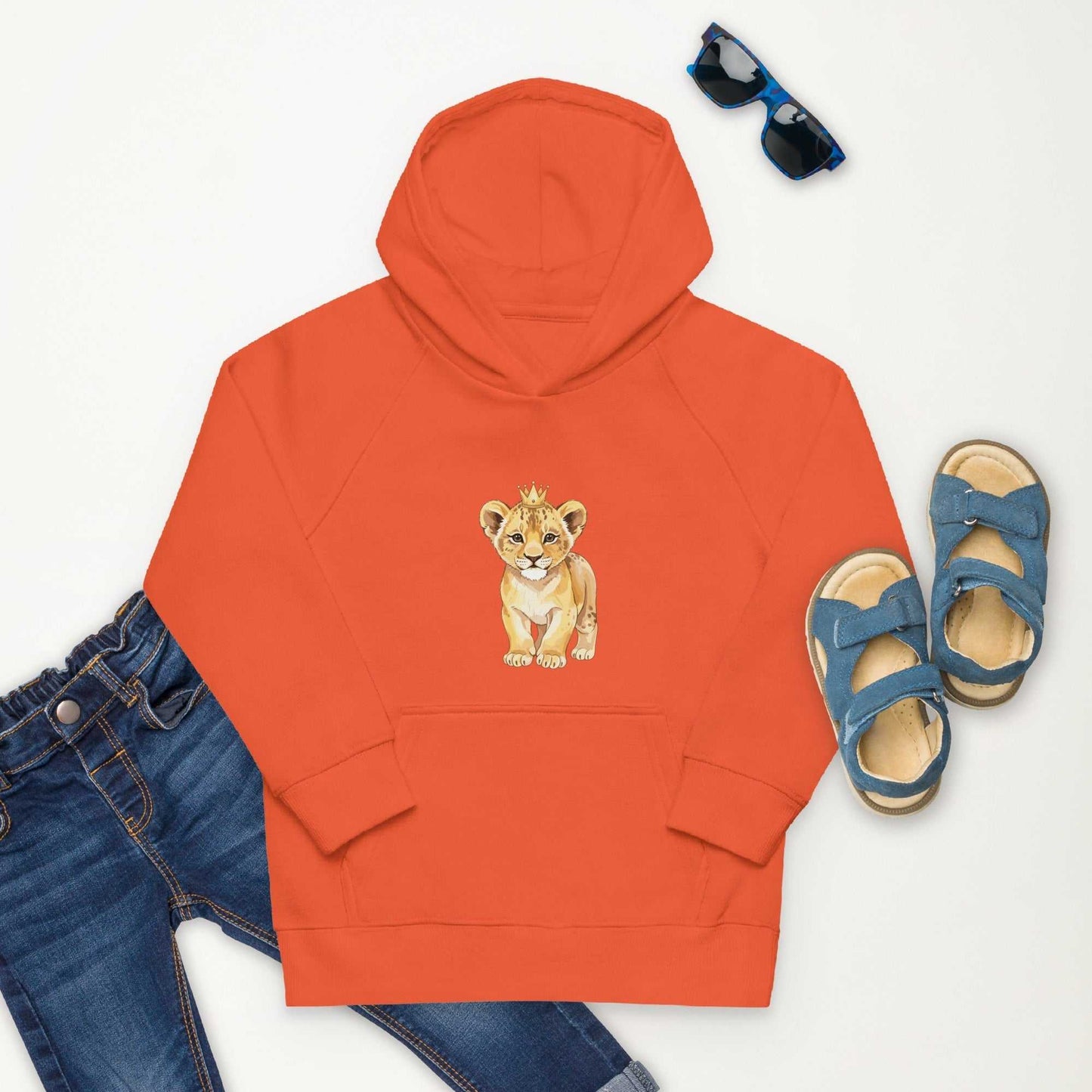 Orange Kids Eco Hoodie with baby lion print, styled with jeans and sandals, combining playful design with sustainable comfort.