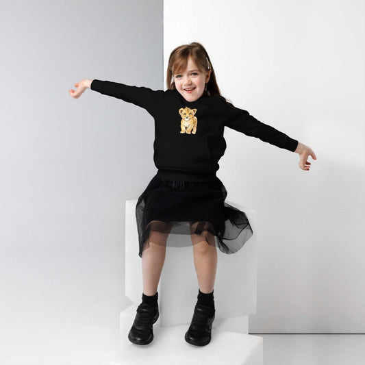 Girl wearing black kids eco hoodie with baby lion design. Cozy organic cotton hoodie perfect for playful everyday wear.