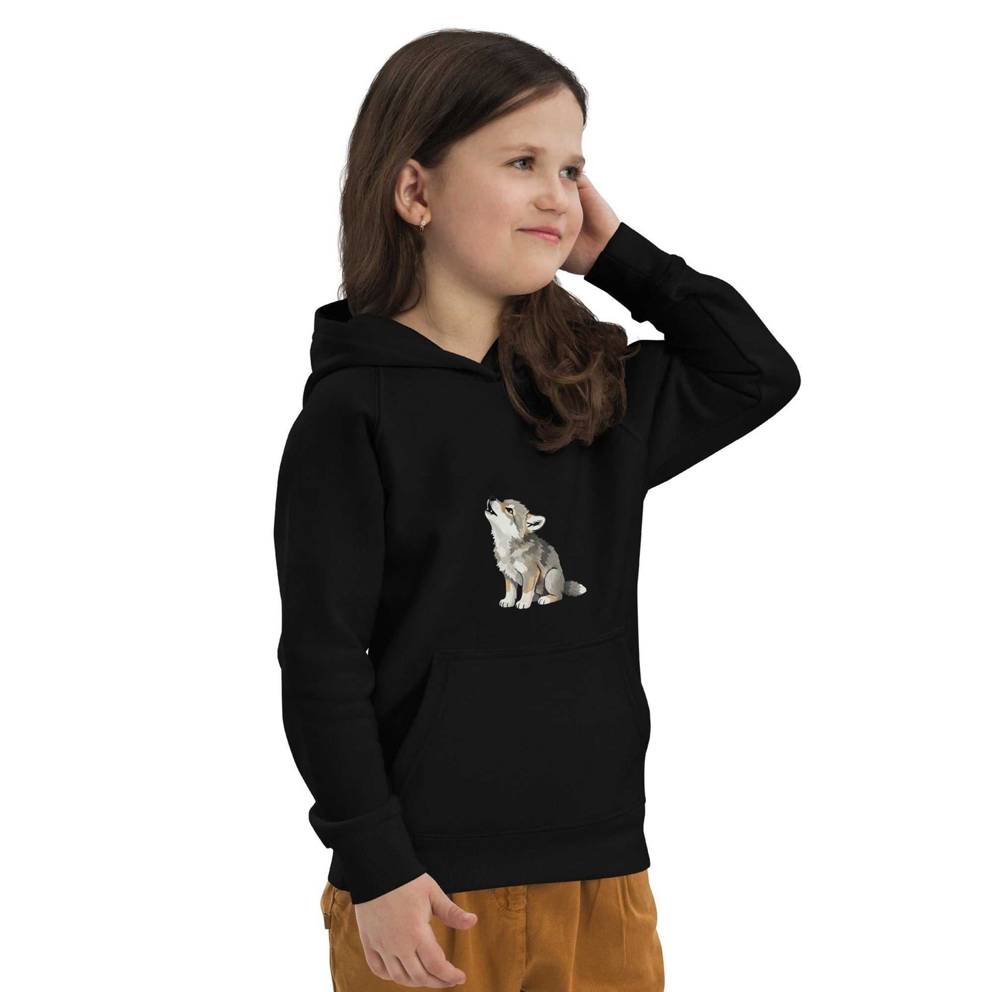 Girl wearing black kids eco hoodie with baby wolf print, made of organic cotton. Perfect for sustainable and stylish children's wear.