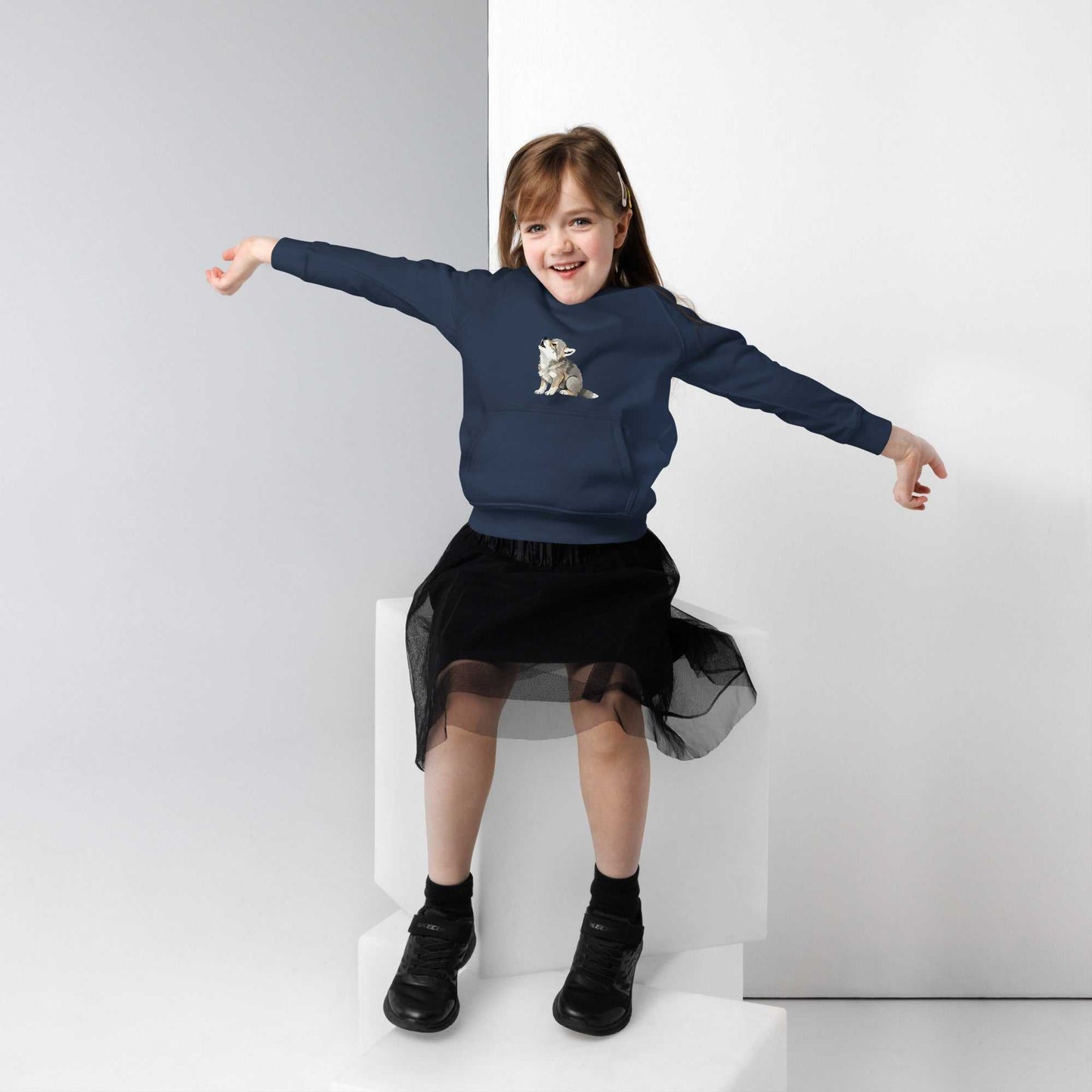Navy blue kids eco hoodie with baby wolf design, modeled by a girl. Organic cotton hoodie offering cozy warmth and eco-friendly fashion.