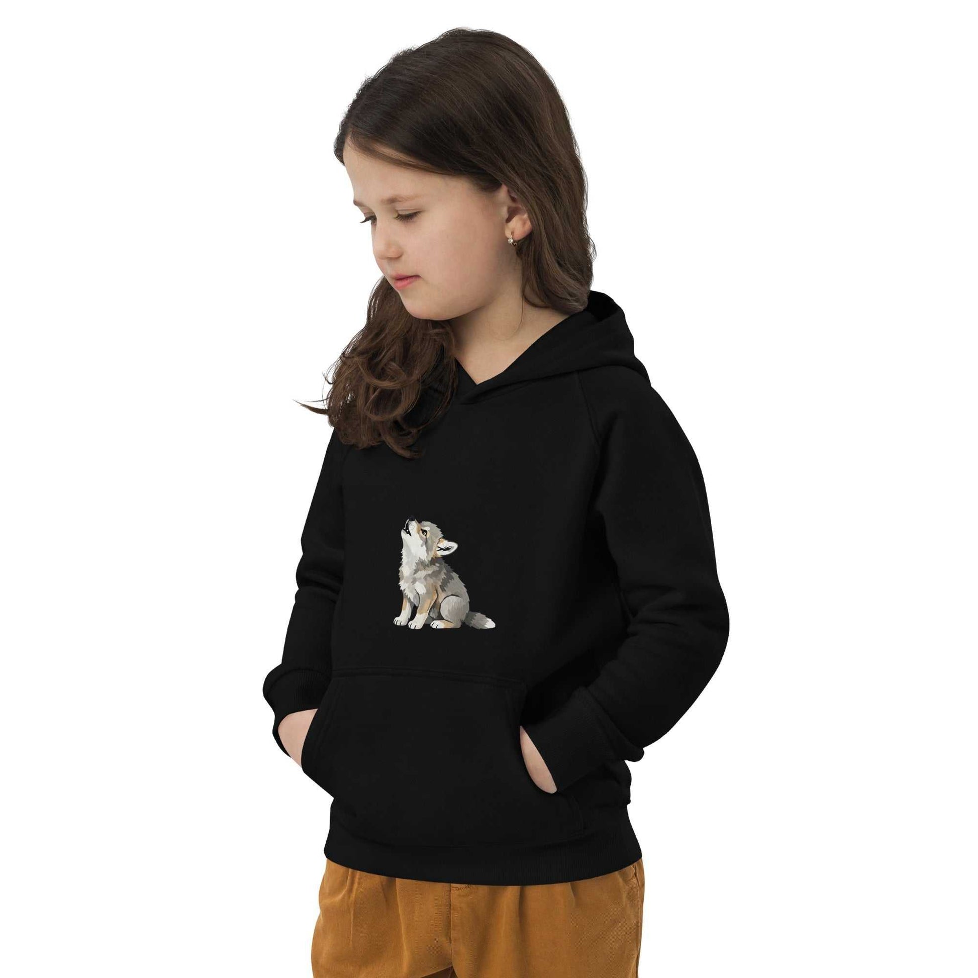 Black kids eco hoodie with baby wolf design, worn by girl. Organic cotton fabric ensures warmth and eco-conscious comfort.