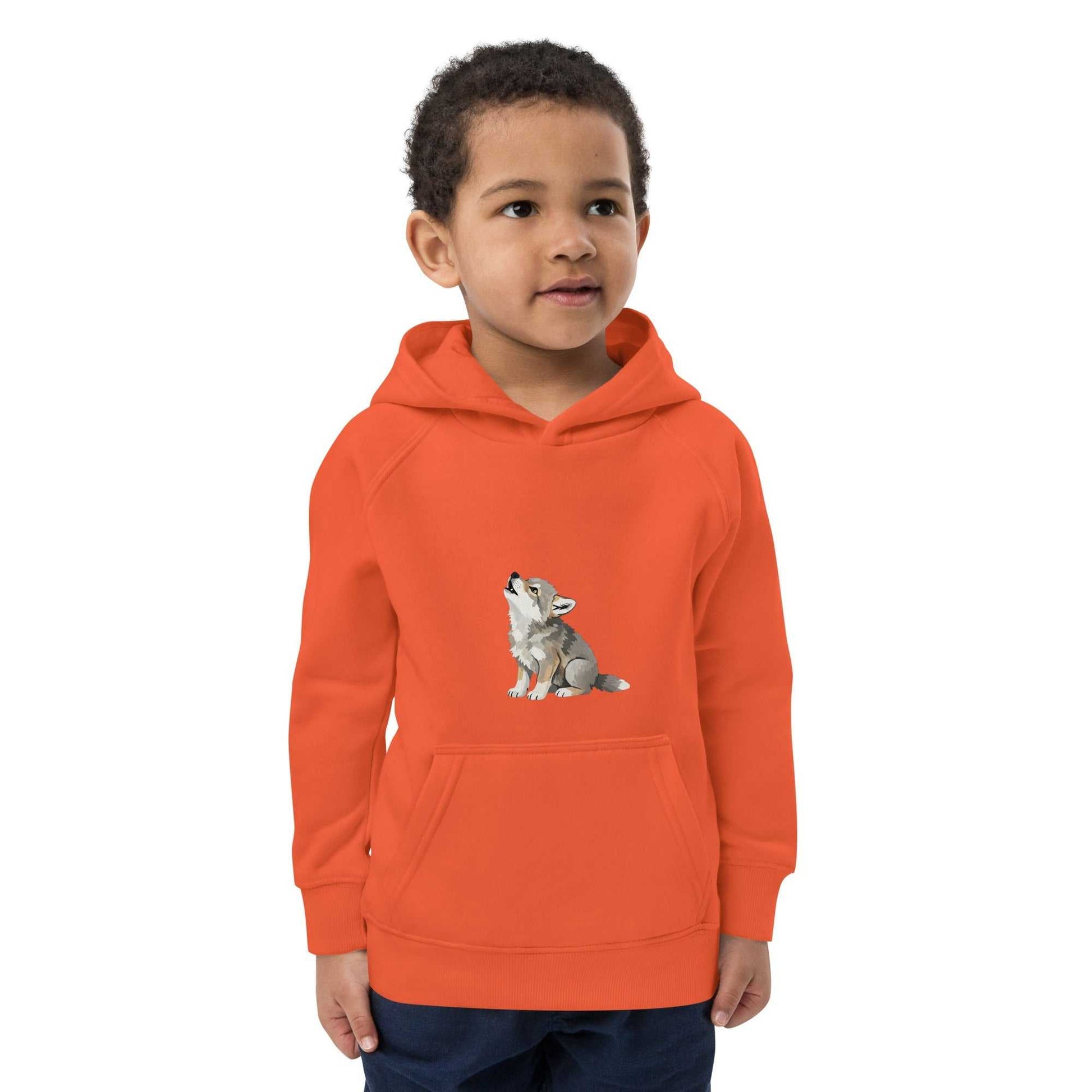 Orange kids eco hoodie with baby wolf design, worn by a boy. Warm and sustainable hoodie made from soft organic cotton for kids.
