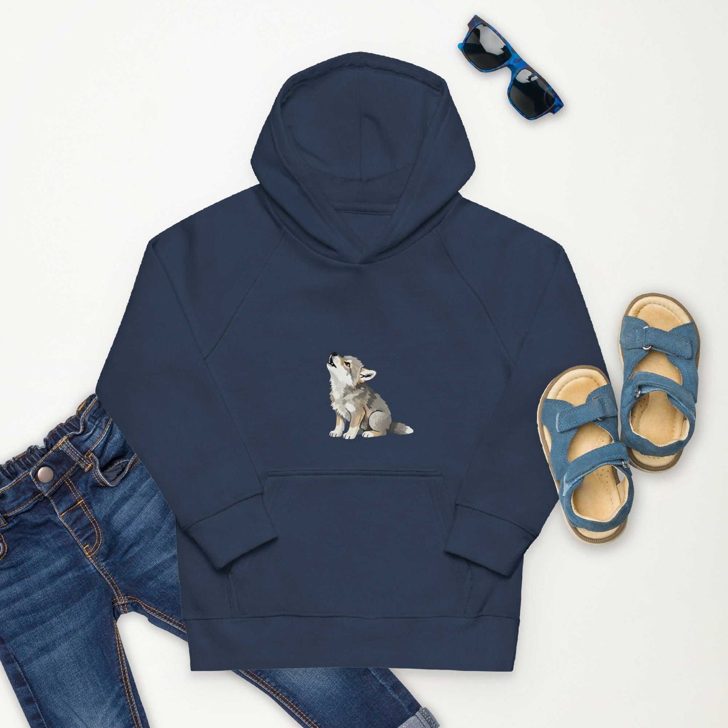 Navy blue kids eco hoodie with baby wolf print, paired with jeans and sandals. Soft and warm organic cotton hoodie.