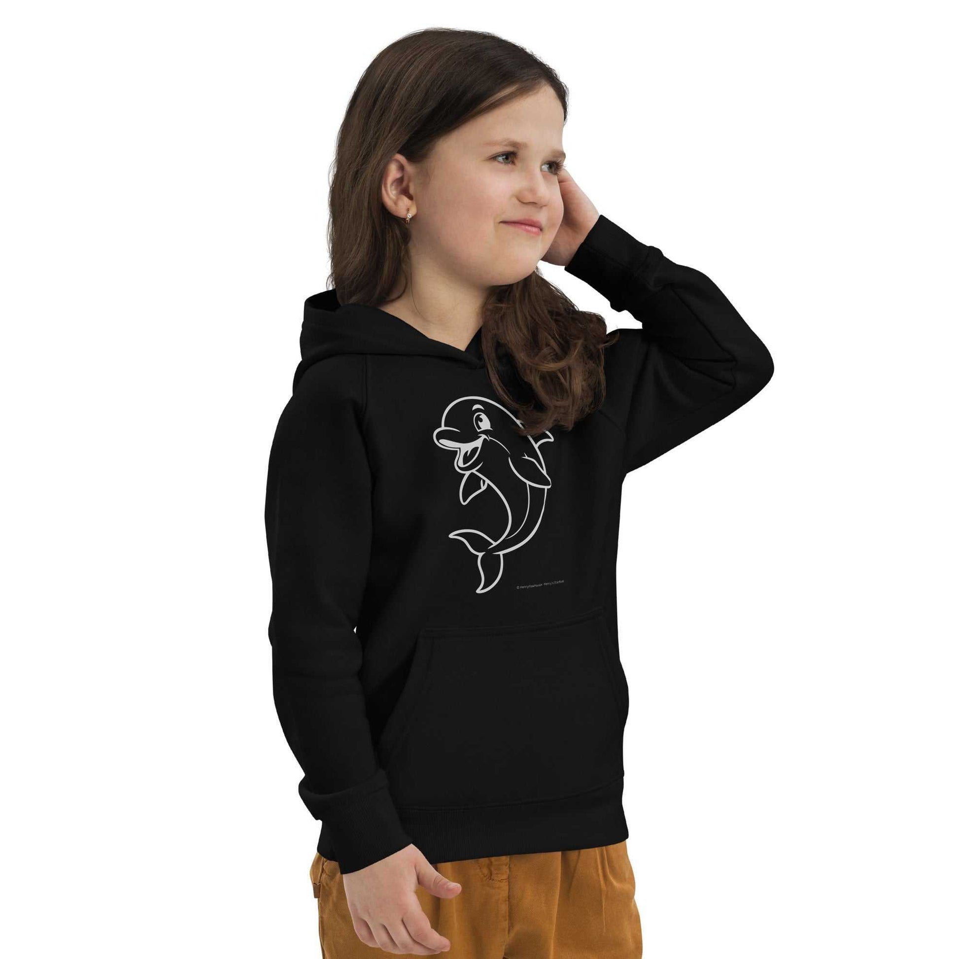 Child modeling black Kids Eco Hoodie Dolphin with dolphin graphic, made from organic cotton. Comfortable and eco-conscious kidswear.