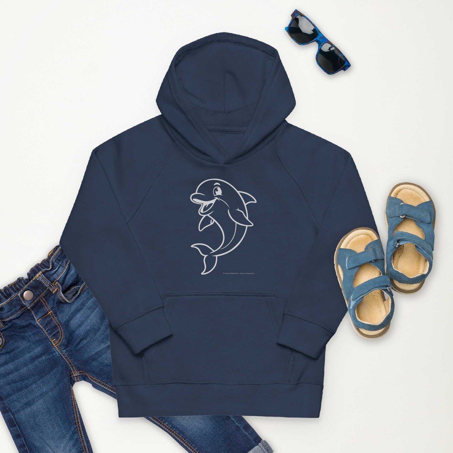 Flat lay of navy Kids Eco Hoodie Dolphin with dolphin design, styled with denim jeans and sandals. Made from eco-friendly materials.