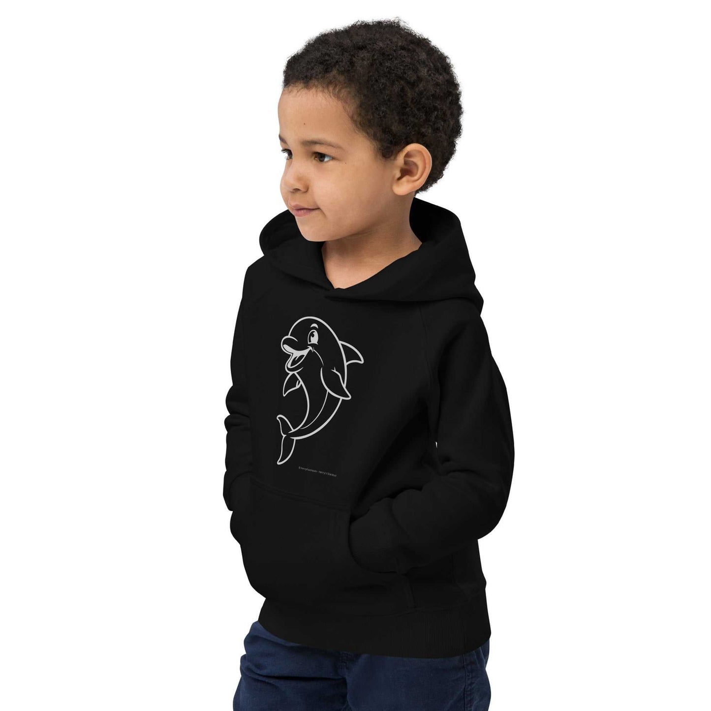 Boy wearing black Kids Eco Hoodie Dolphin with dolphin design, hands in pockets. Organic cotton hoodie for kids' everyday wear.