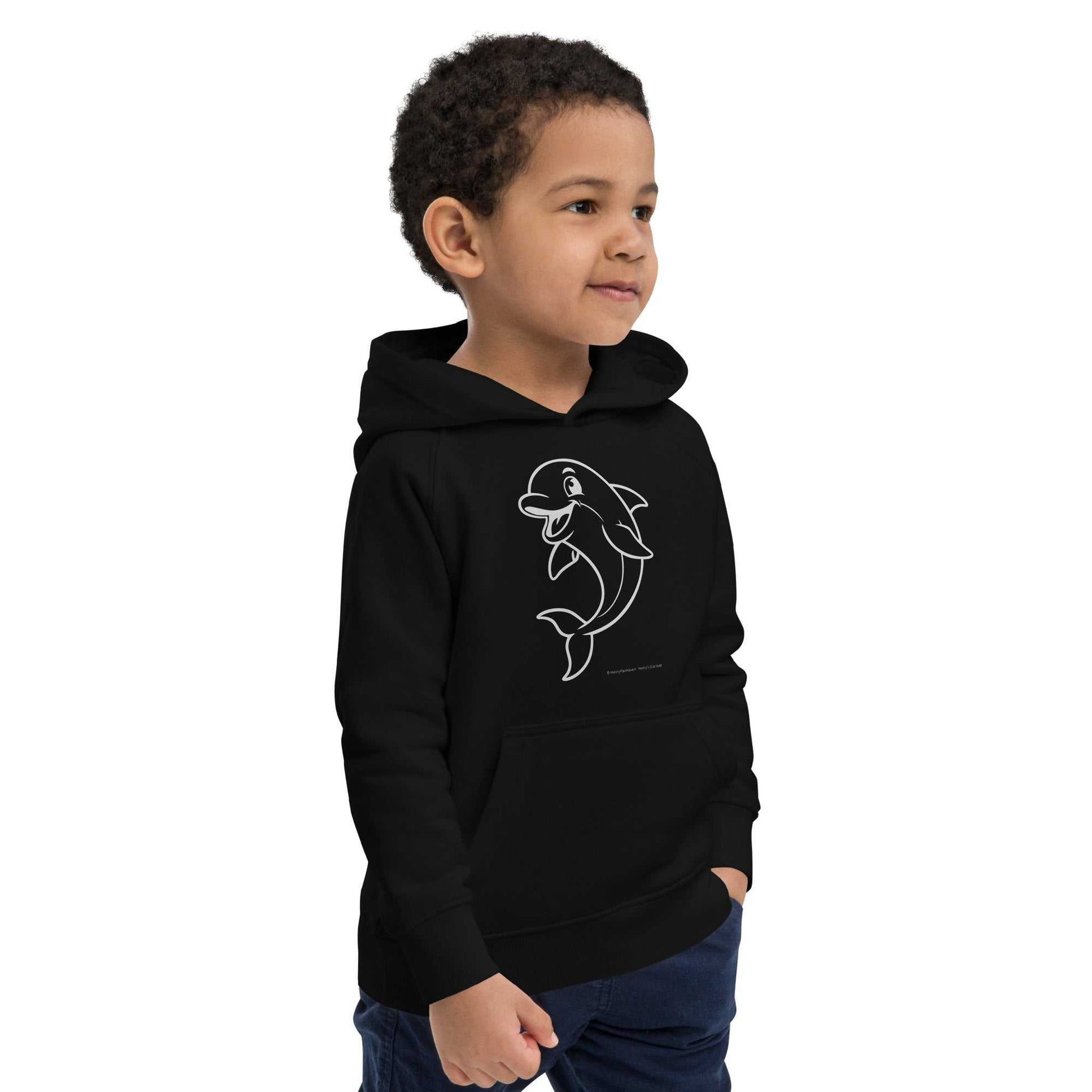 Boy in black Kids Eco Hoodie Dolphin with dolphin illustration, side pose. Ideal for young adventurers and sustainable fashion lovers.