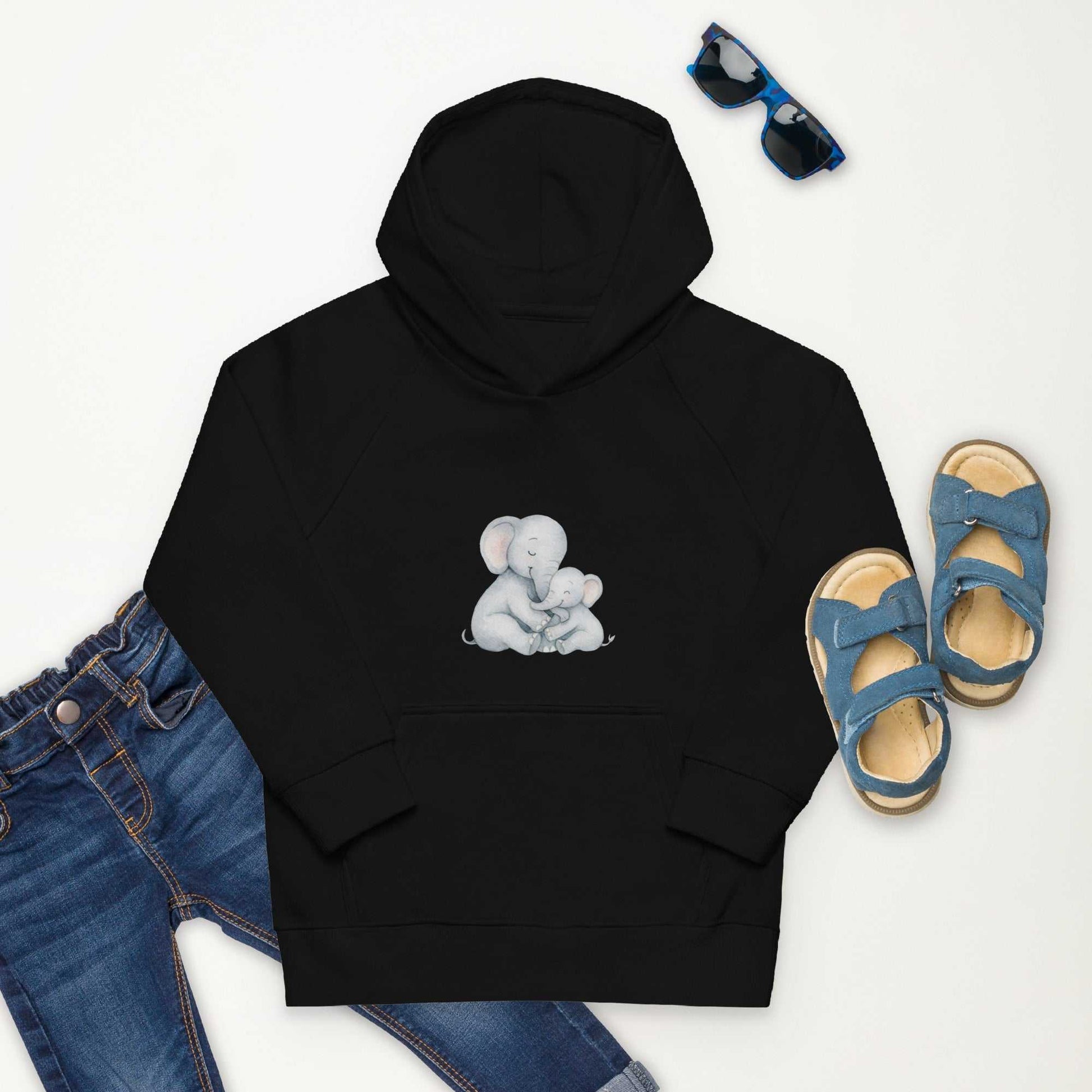 Black Kids Eco Hoodie with elephant design, paired with jeans and blue sandals, ideal for casual eco-friendly children's fashion.