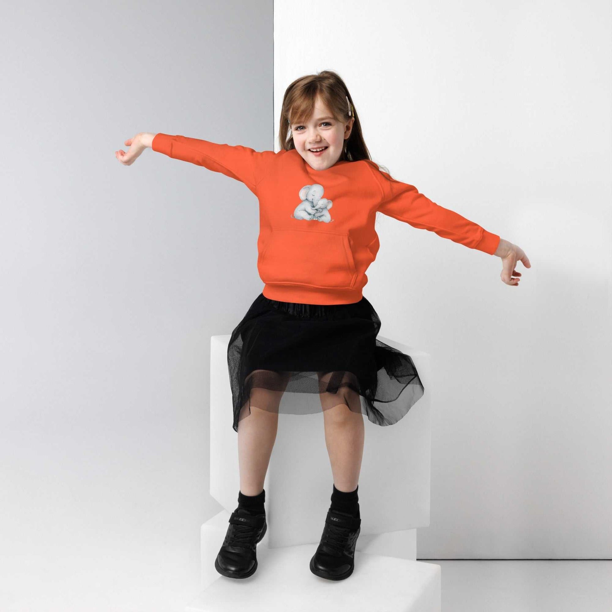 Bright orange kids eco hoodie with cute mom & baby elephant graphic, made from organic cotton for eco-friendly comfort.