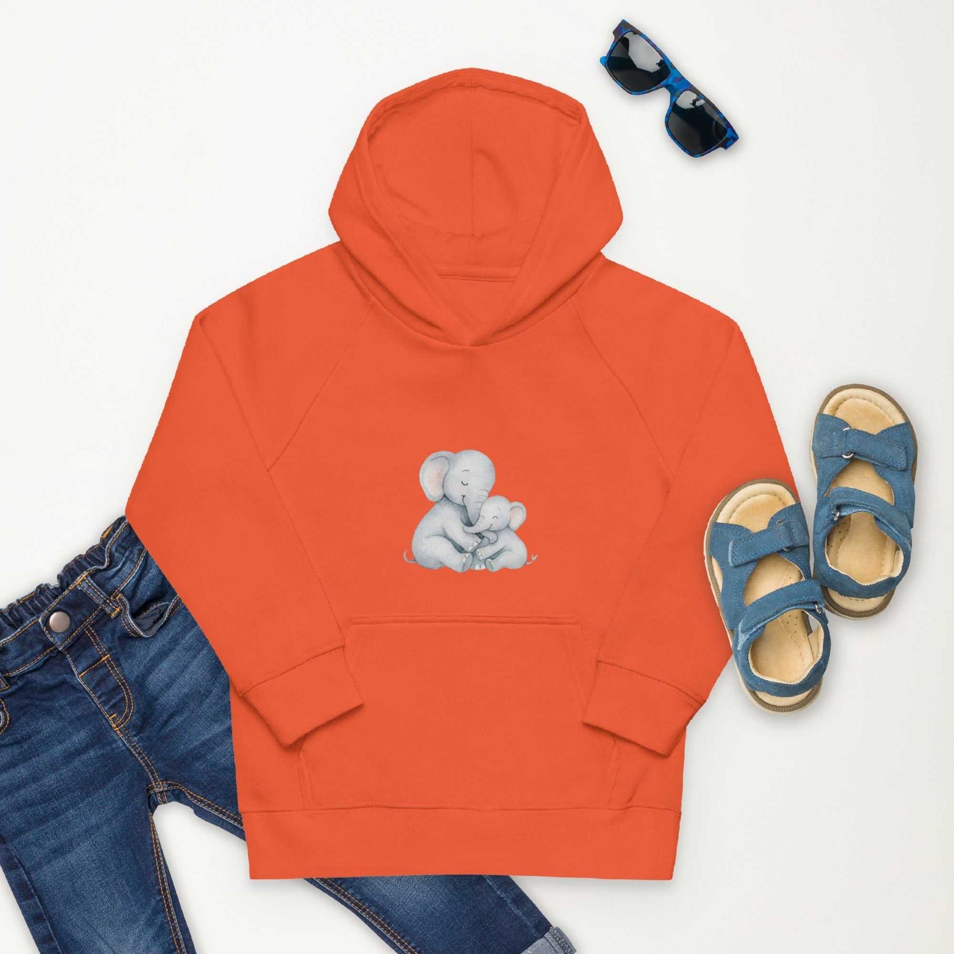Orange Kids Eco Hoodie with elephant design, matched with jeans and sandals, offering a bright and eco-conscious kidswear option.