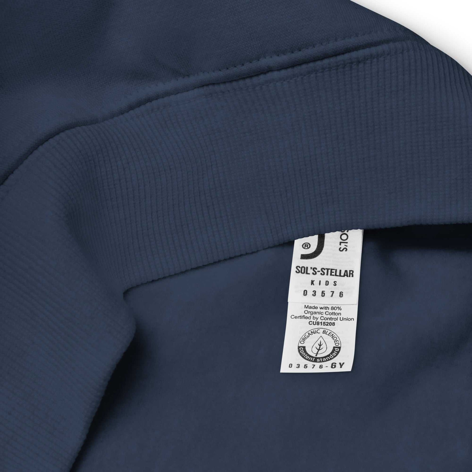 Interior label of navy blue kids eco hoodie, indicating organic cotton content and certified eco-friendly production.