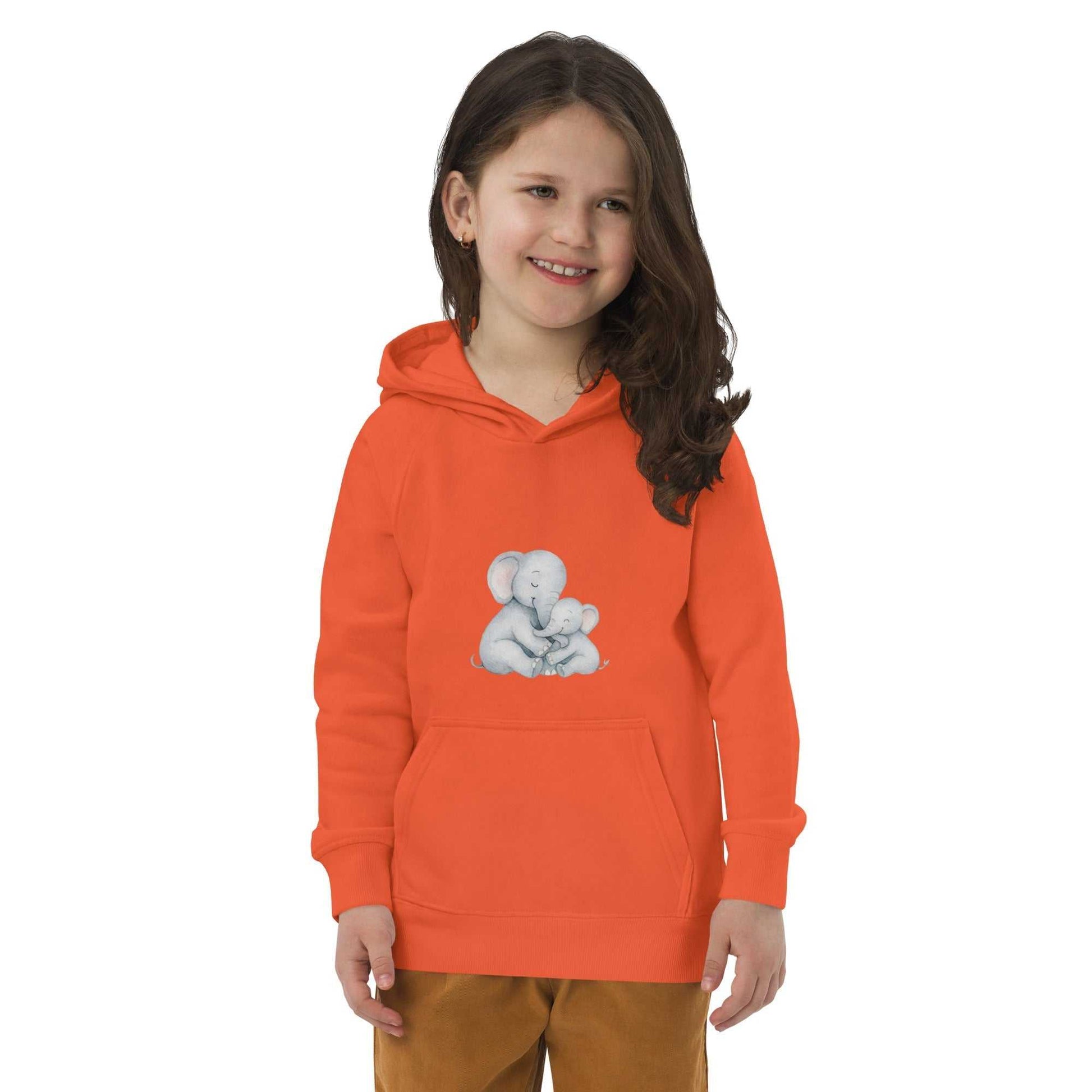Smiling child in orange Kids Eco Hoodie with elephant design, crafted from organic cotton for a soft and vibrant eco-friendly outfit.