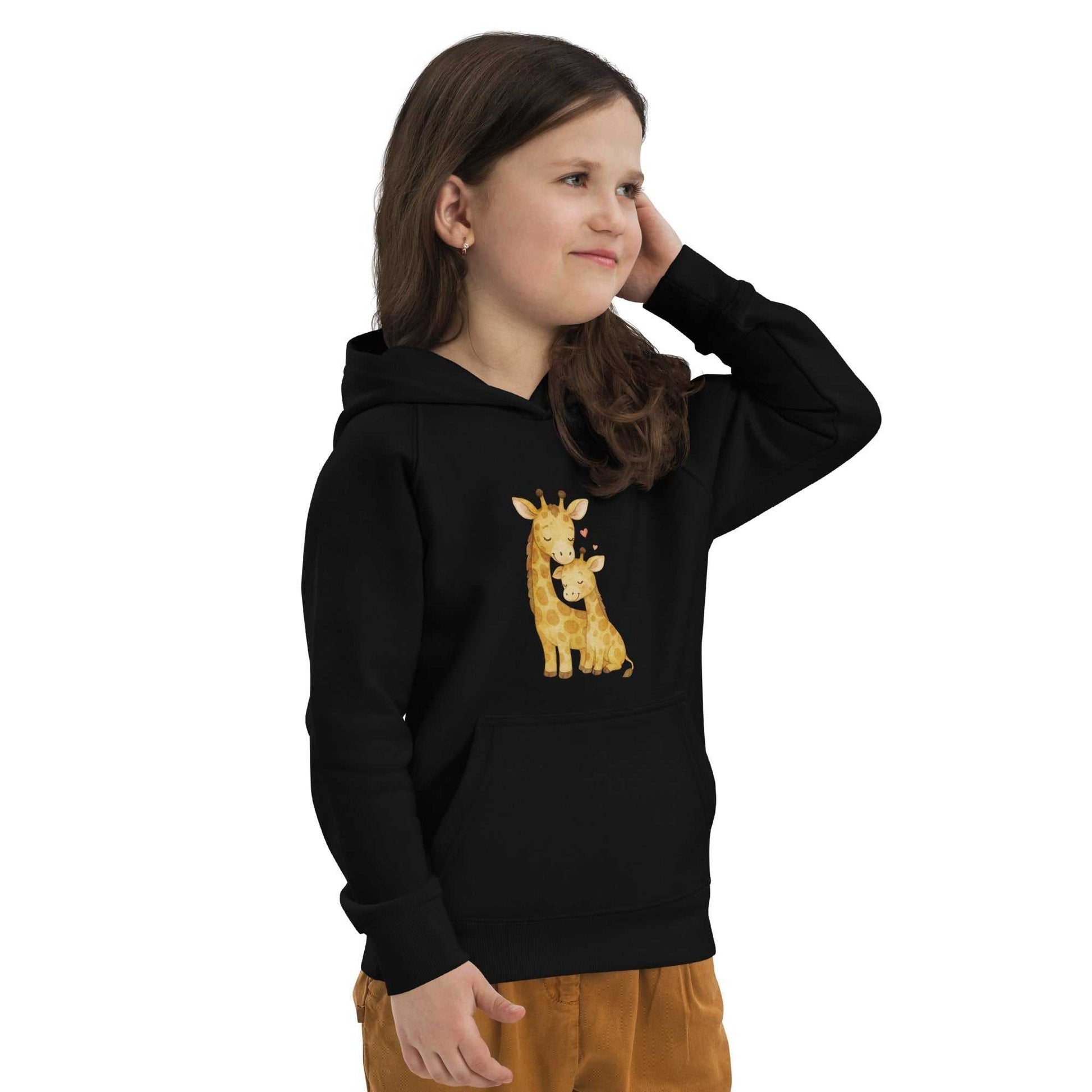 Side view of child in black kids eco hoodie featuring giraffe design. Cozy and sustainable hoodie made from organic cotton.