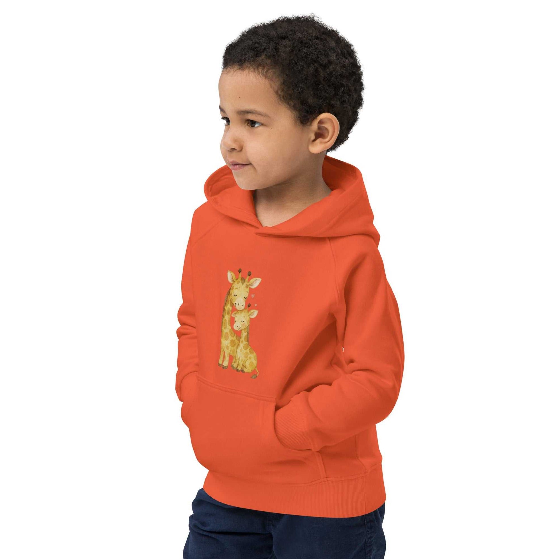 Orange kids eco hoodie with front pocket and giraffe design. Warm, organic cotton hoodie for children’s activewear.