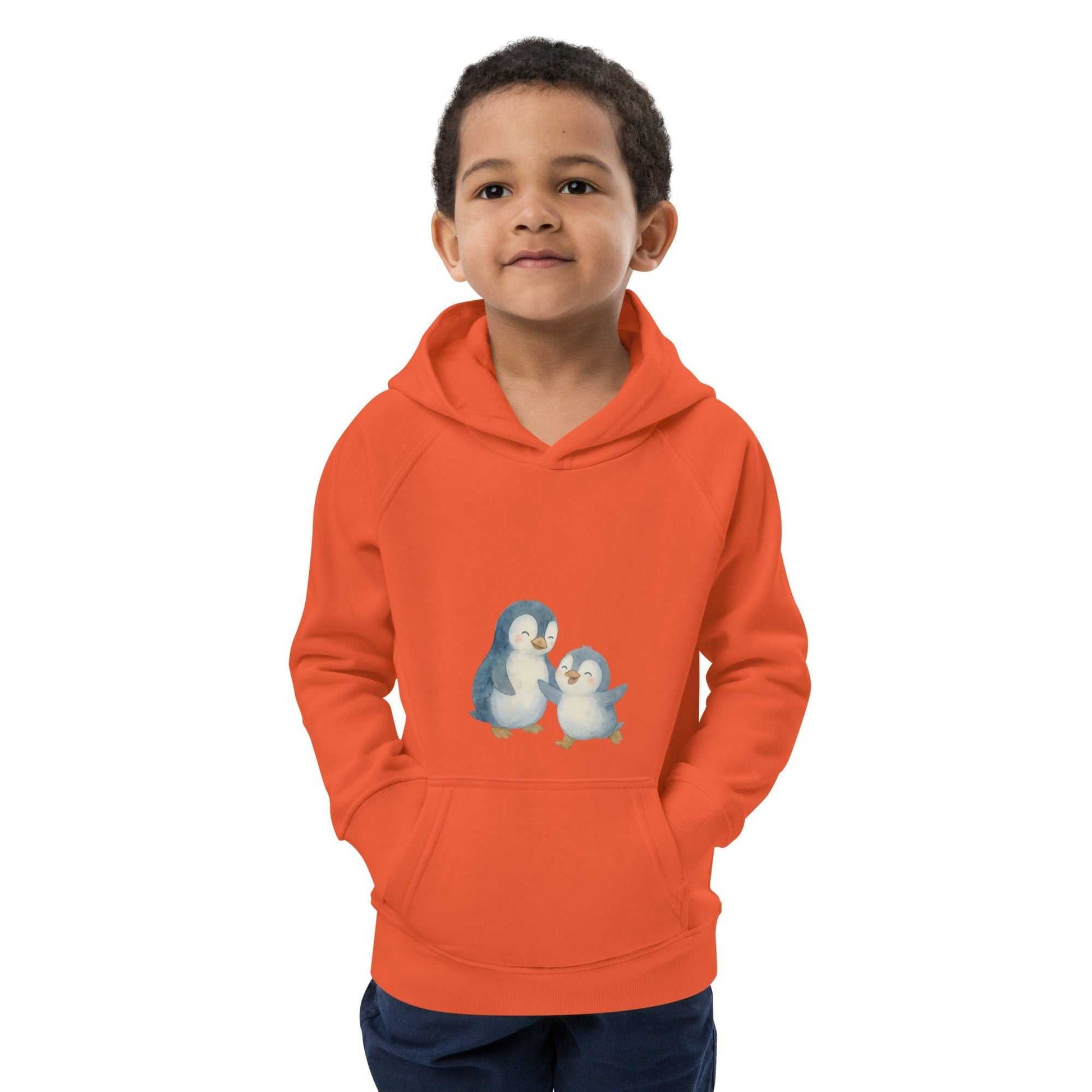 Orange organic cotton hoodie for children with adorable penguin illustration, soft and warm for everyday comfort.