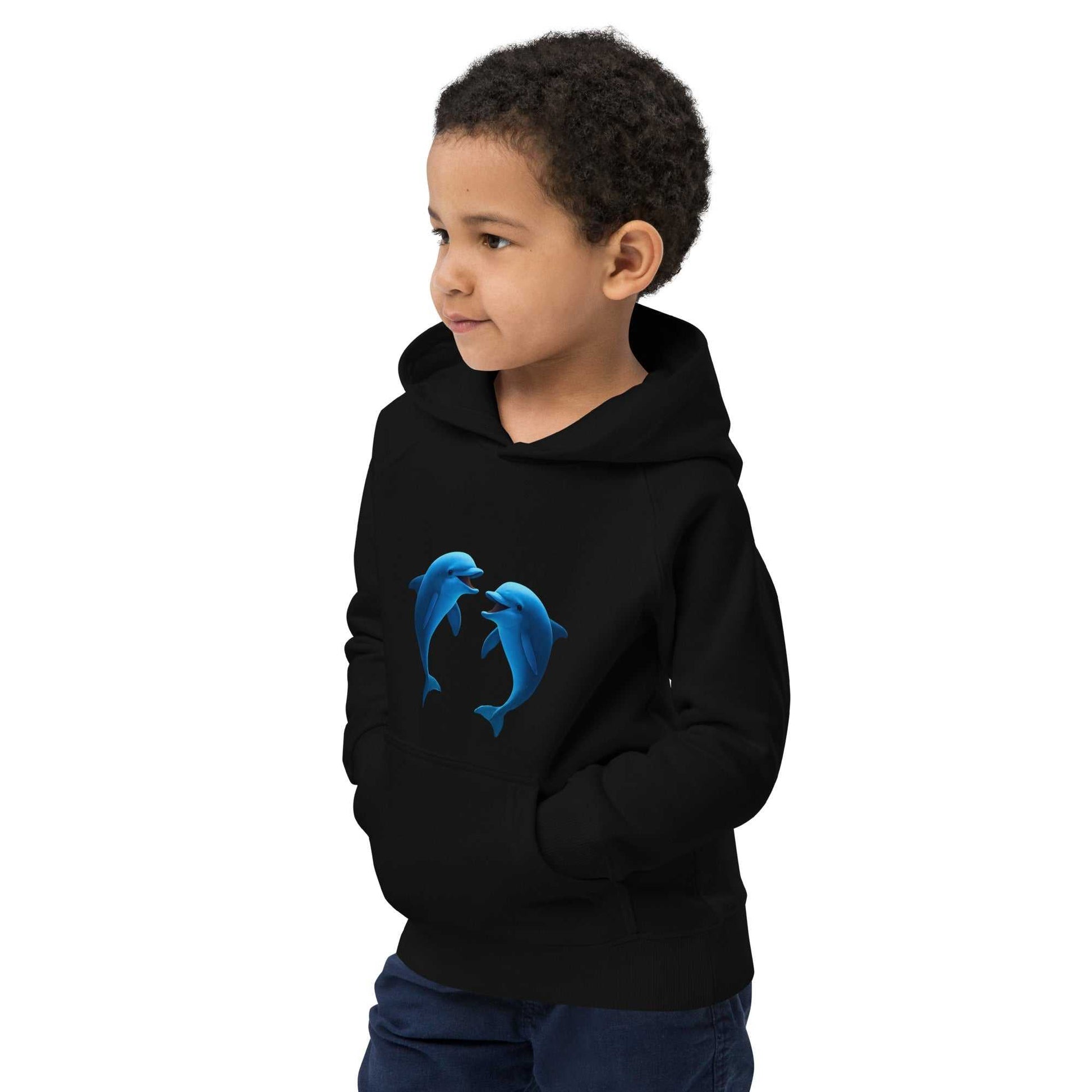 Child wearing black eco-friendly dolphin hoodie made from organic cotton. Soft and durable activewear for kids who love marine life.