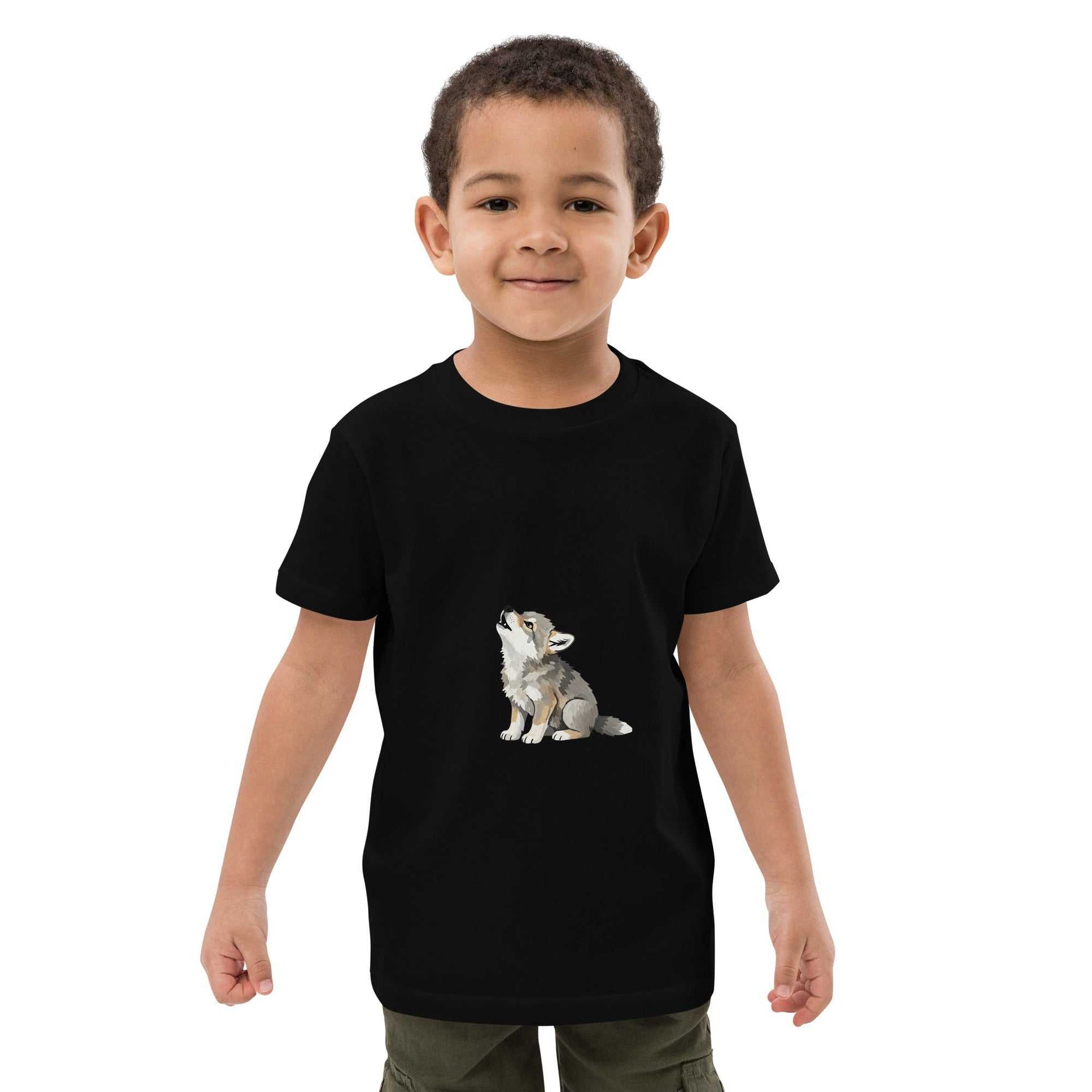 Front view of child wearing black Kids Organic Cotton T-Shirt with Baby Wolf Design by HenryPawHaven. Eco-friendly and soft fabric.
