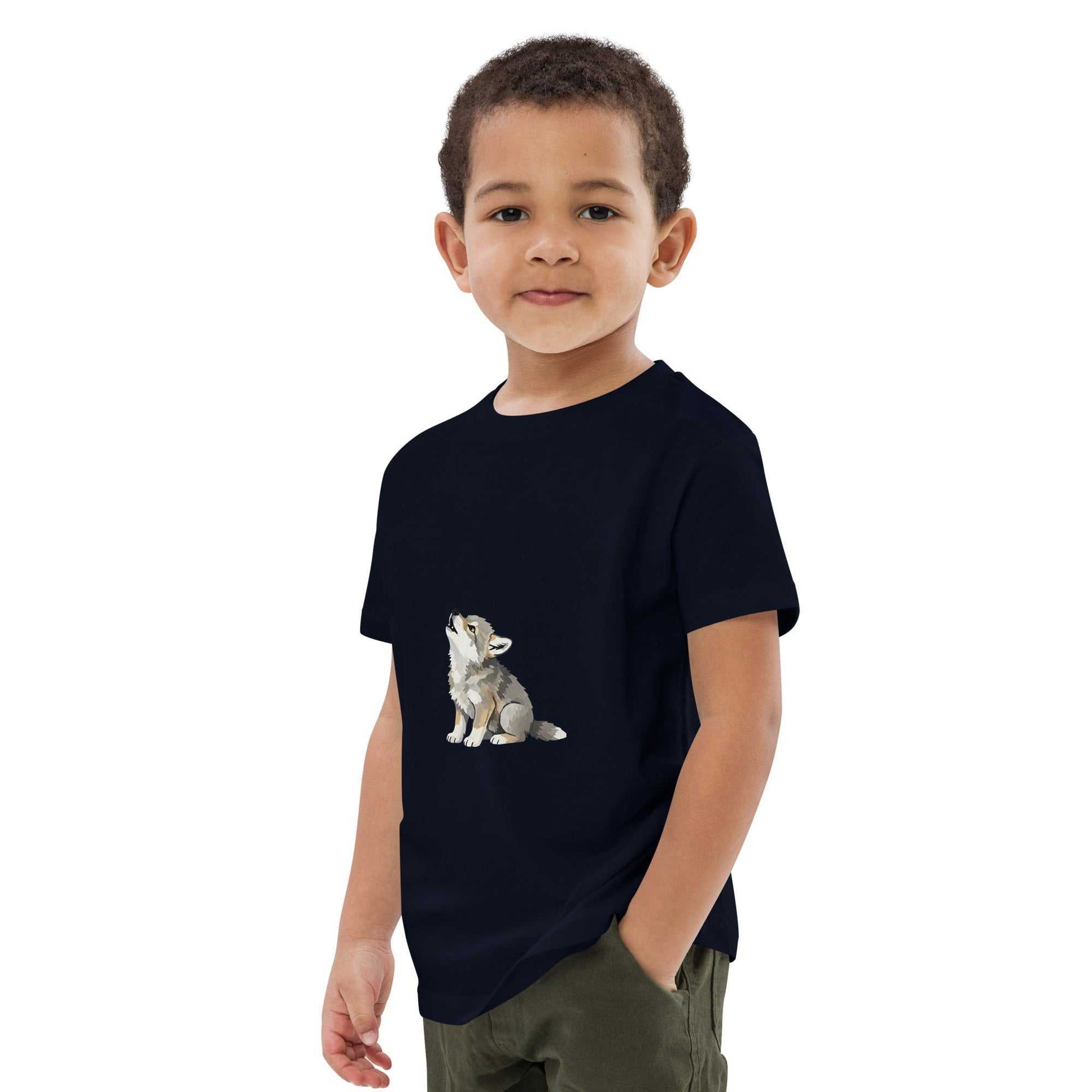 Side view of child in navy Kids Organic Cotton T-Shirt with Baby Wolf Design by HenryPawHaven. Sustainable and stylish toddler wear.