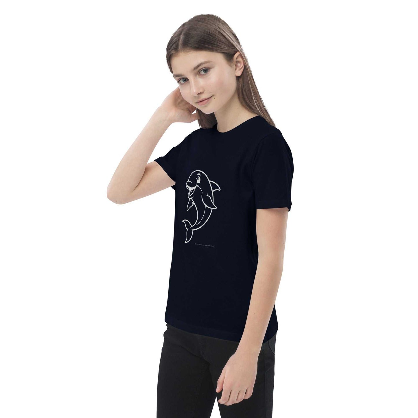 Child touching hair while wearing navy Kids Organic Cotton T-Shirt with Dolphin Design. Eco-conscious and GOTS certified apparel.