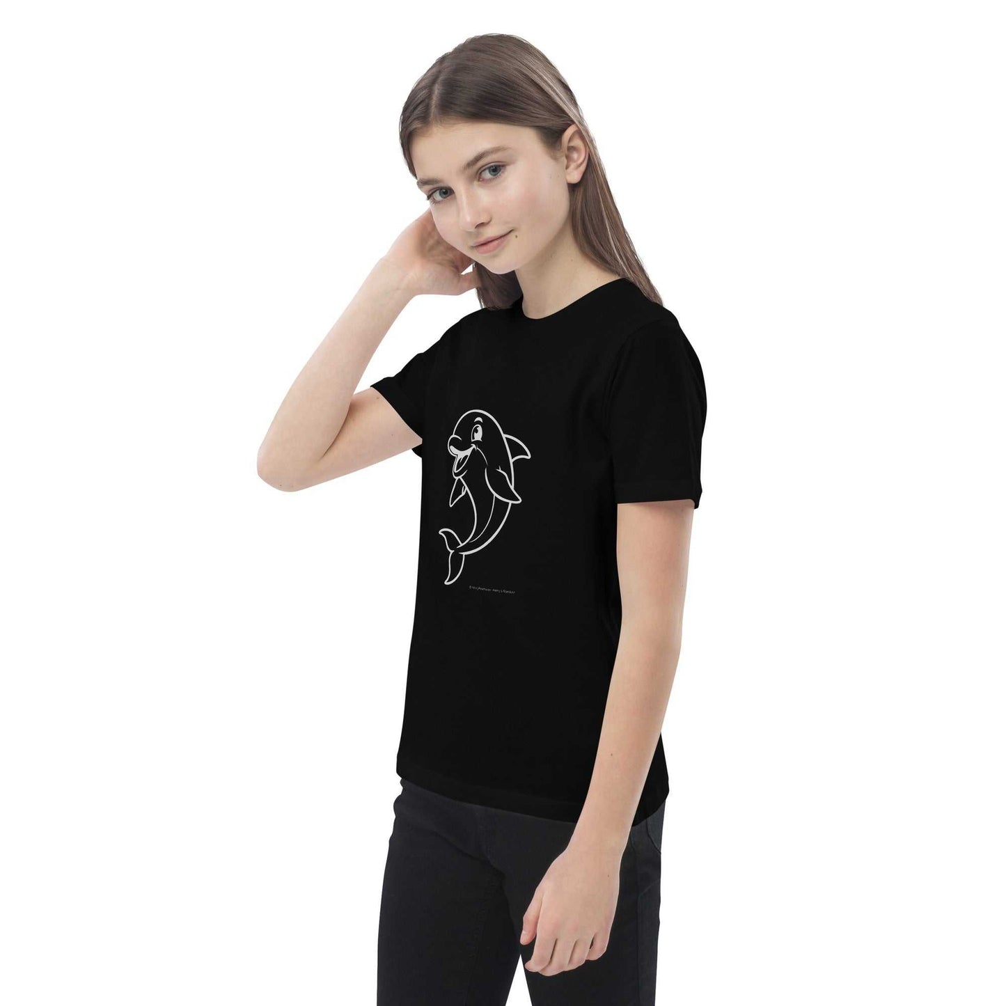 Child posing in black Kids Organic Cotton T-Shirt with Dolphin Design. Made from eco-friendly, GOTS certified organic cotton.