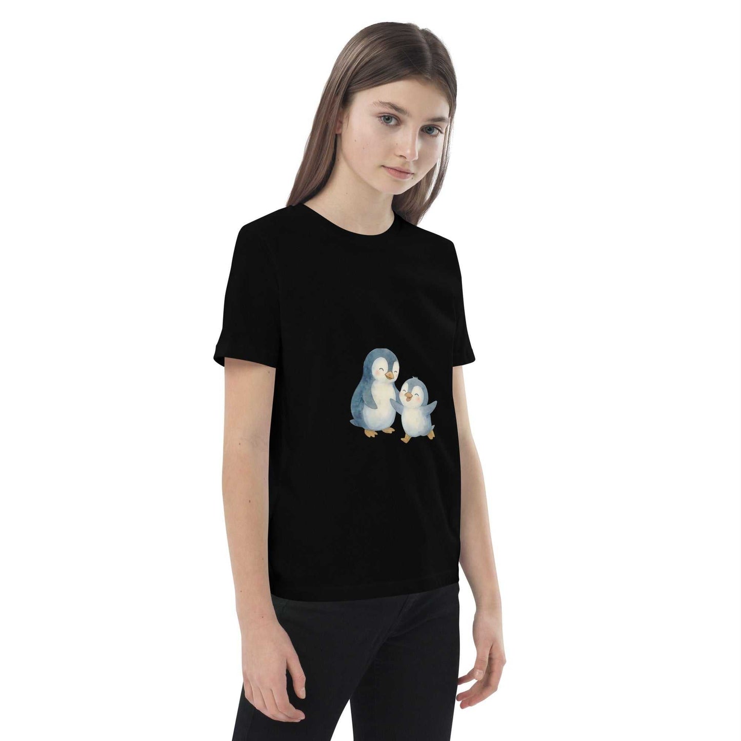Side view of girl in black Kids Organic Cotton Penguin T-Shirt, showcasing eco-friendly penguin print and comfortable fit.