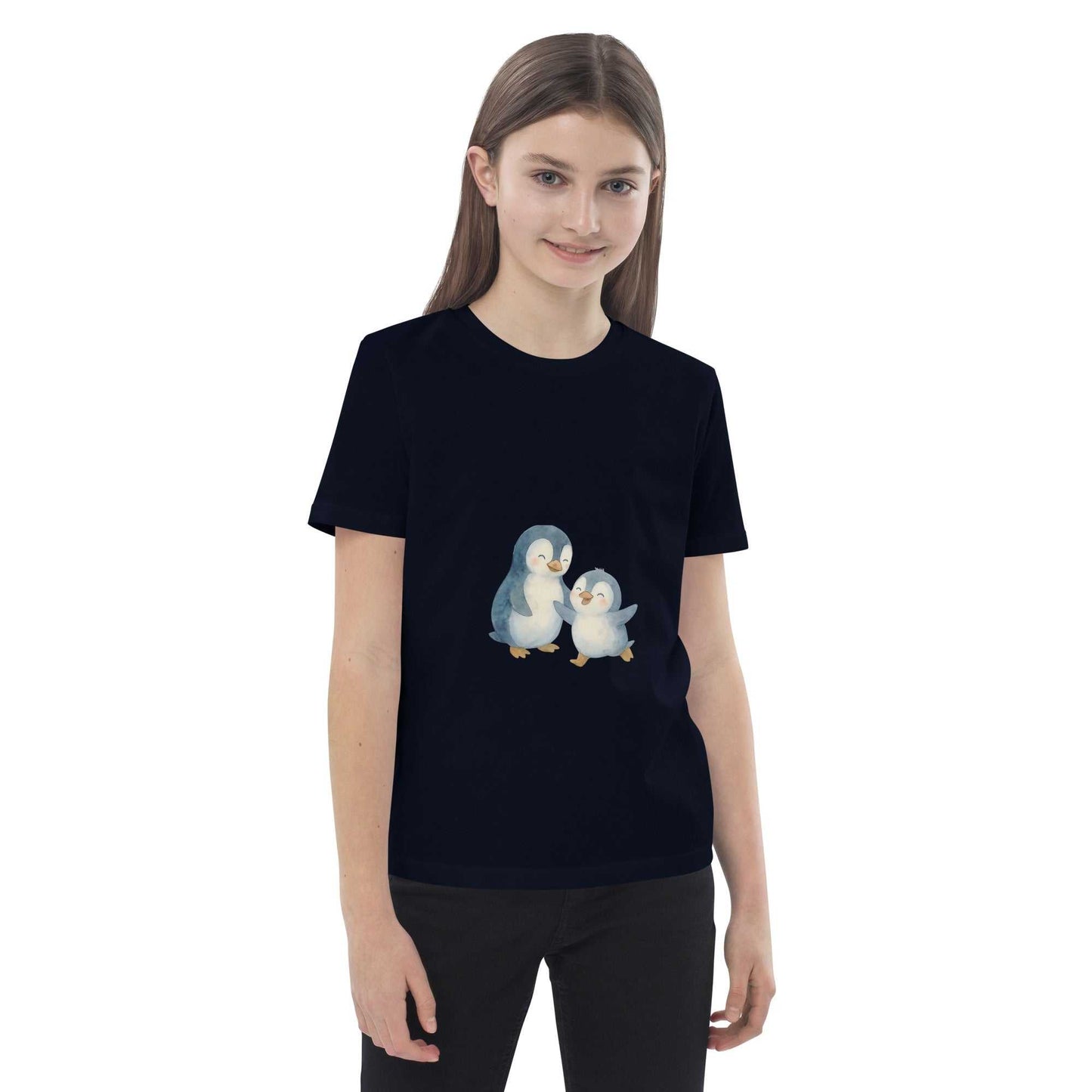 Smiling girl in navy Kids Organic Cotton Penguin T-Shirt, featuring eco-friendly penguin print and organic cotton material.