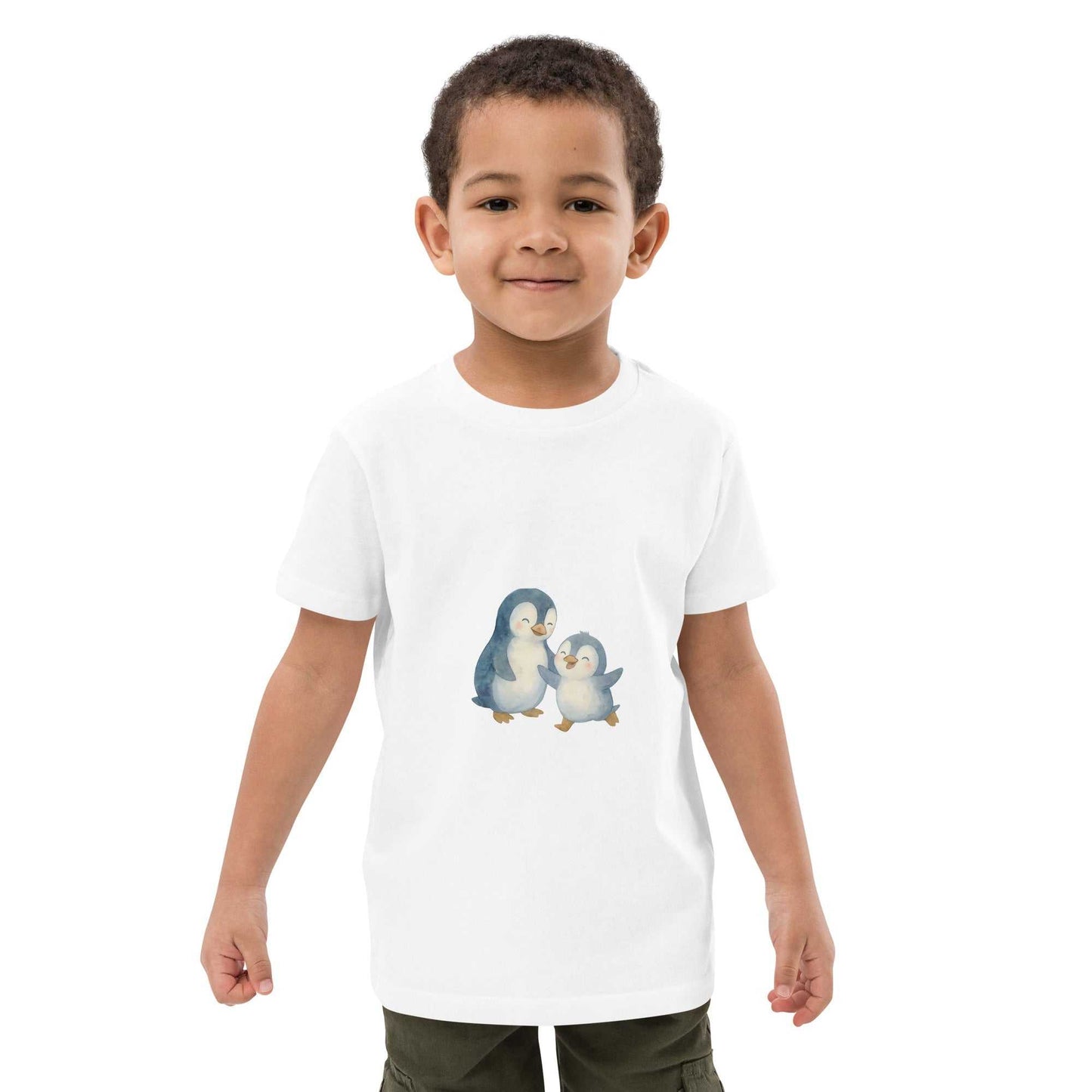 White kids organic cotton penguin t-shirt with cute penguin print, worn by boy. Soft, eco-friendly, and GOTS certified.