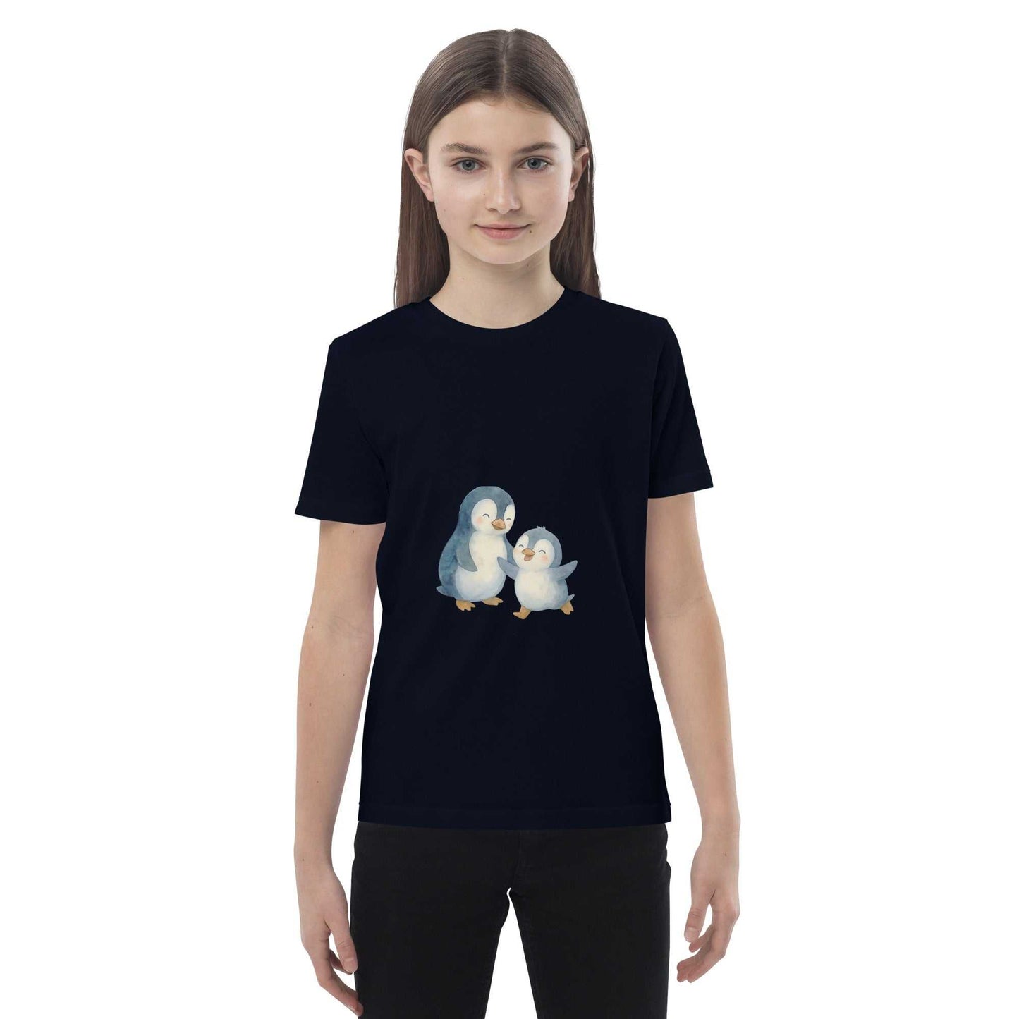 Girl wearing navy Kids Organic Cotton Penguin T-Shirt with soft, certified fabric and playful penguin artwork.