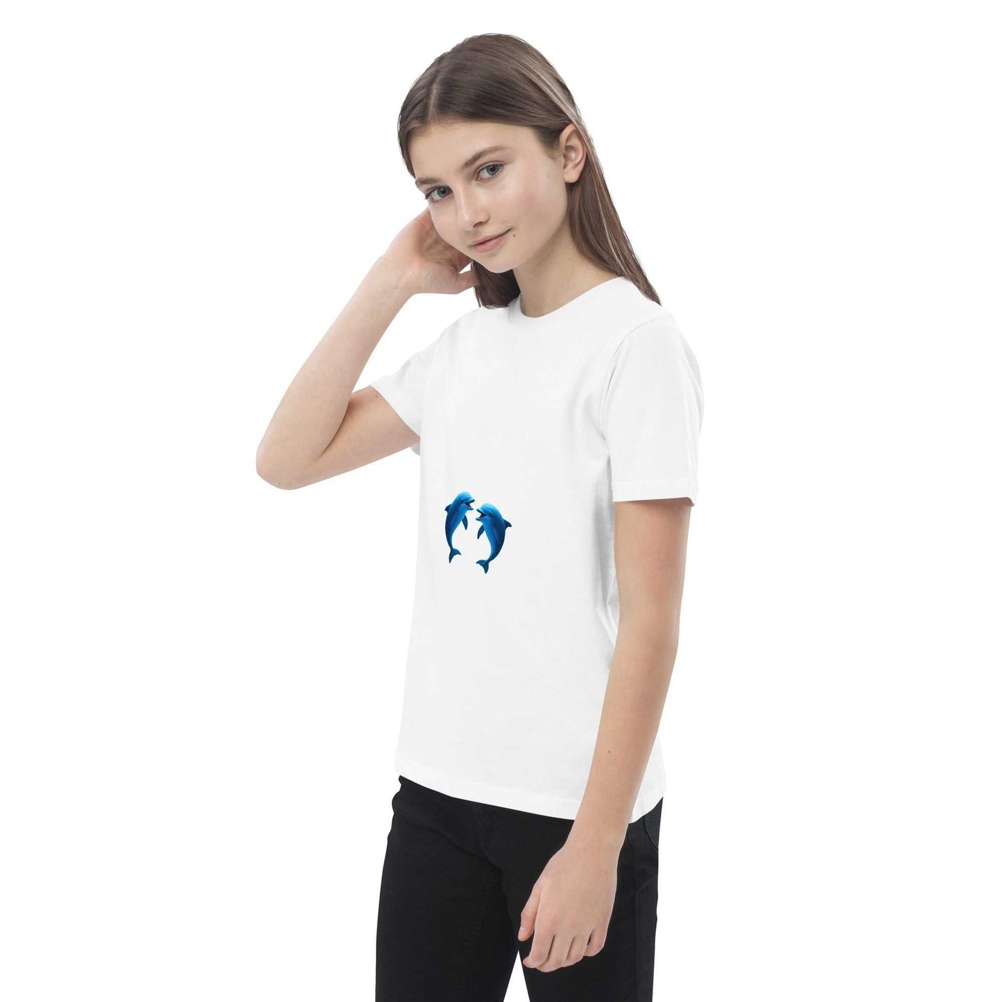 Child touching hair while wearing white Kids Organic Cotton T-Shirt with dolphin print. Soft, breathable, and eco-conscious.