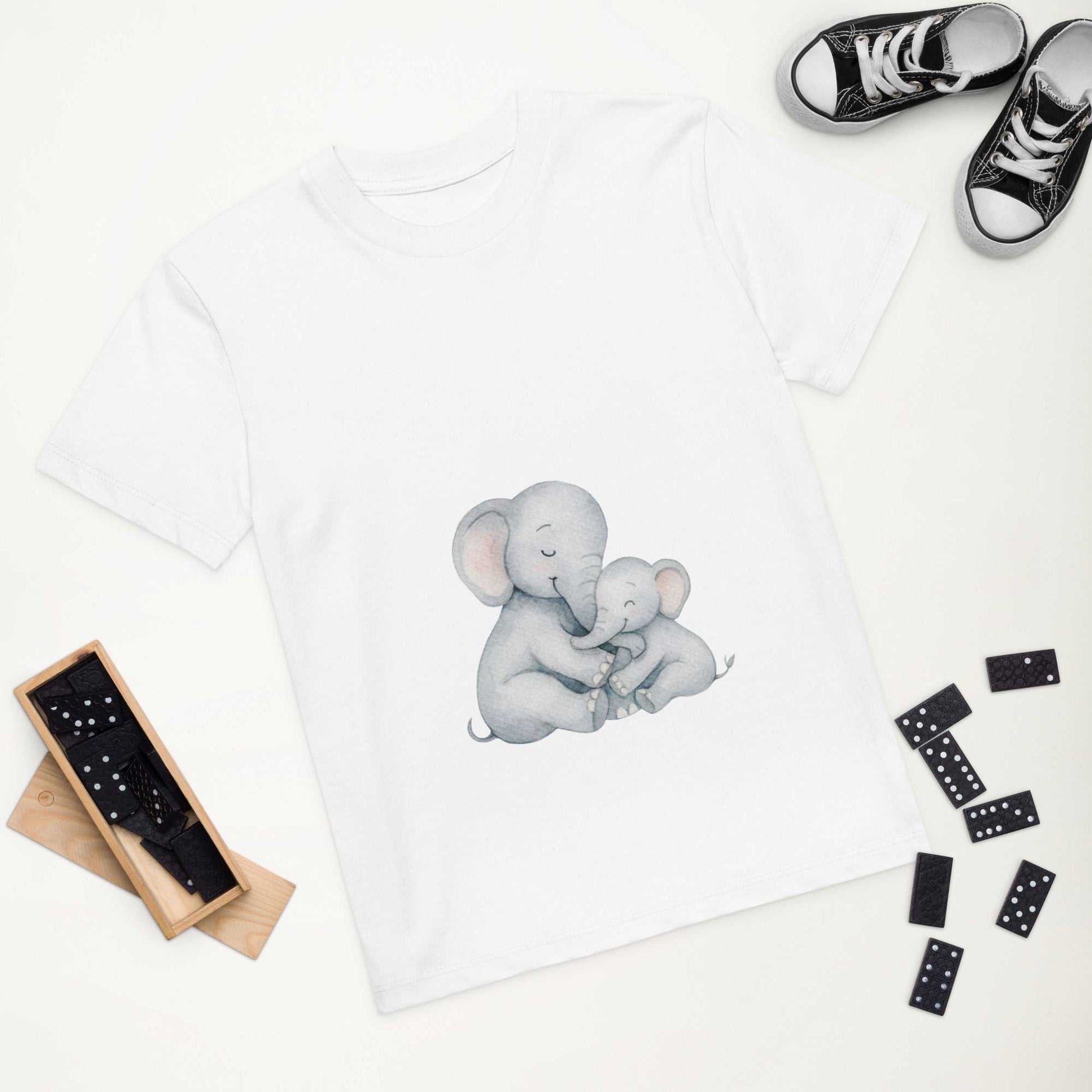White Kids Organic Cotton T-Shirt with elephant design shown flat lay. Eco-friendly, GOTS certified kids clothing top.