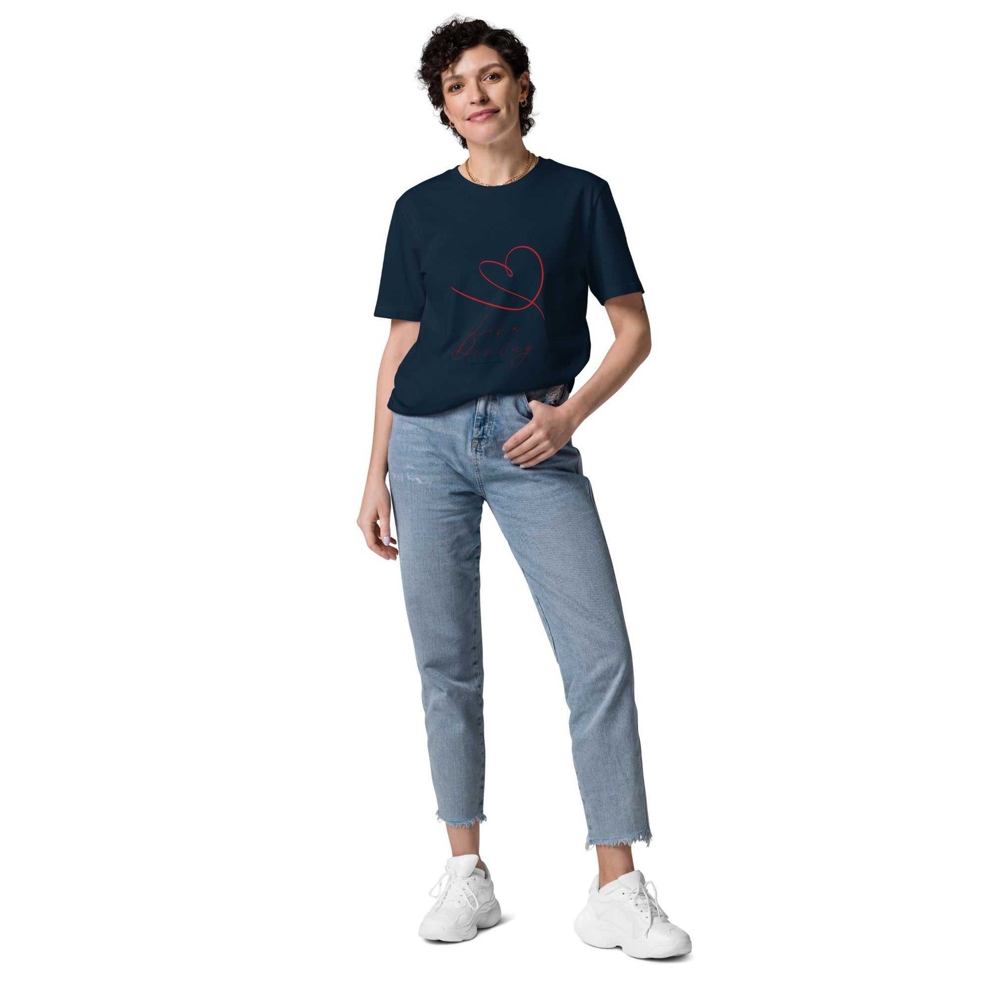 Navy unisex organic cotton t-shirt with red filigrane heart and 'Love Diving' text, paired with jeans for a casual eco-friendly look.