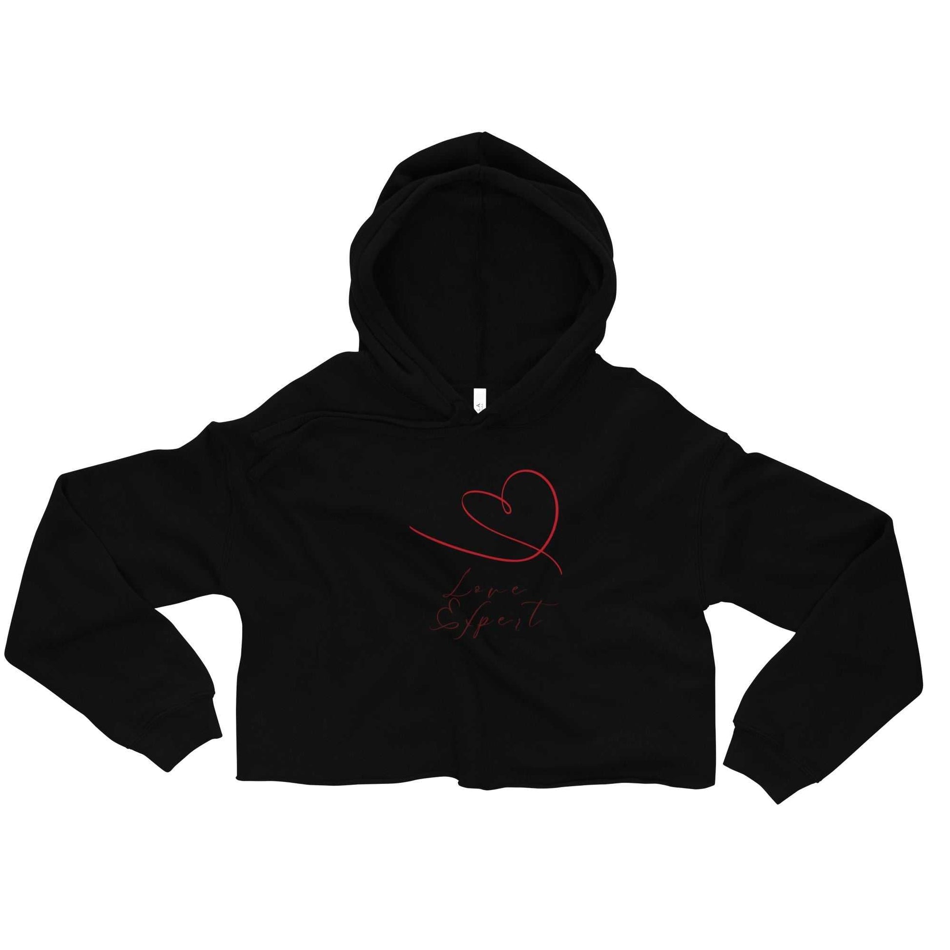 Black women's cropped hoodie with red hand-drawn heart and 'Love Expert' design. Trendy and soft, perfect for Valentine's or everyday wear.