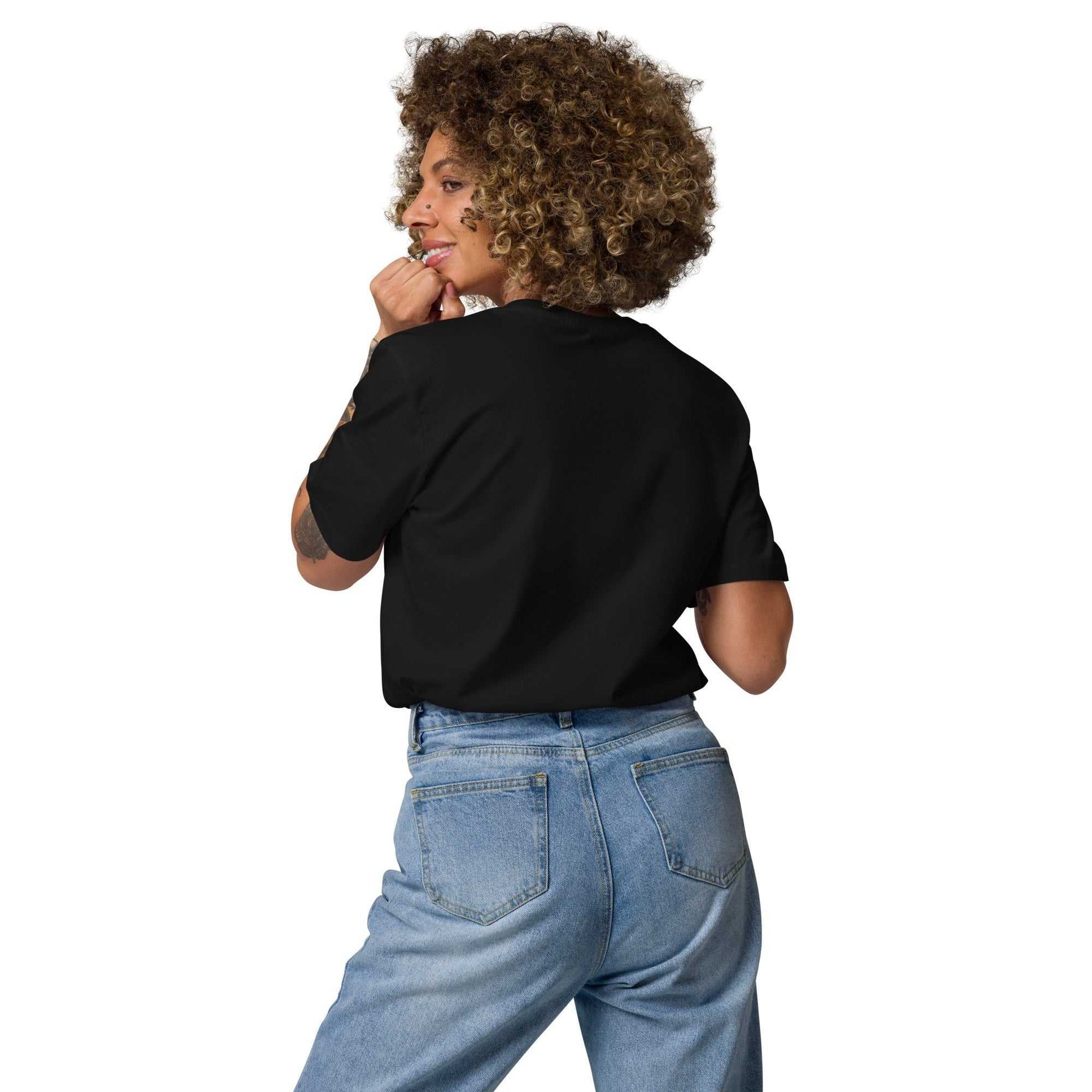Back view of model in black Love Friends organic cotton t-shirt. Sustainable unisex fashion with minimalist heart design for casual outfits.