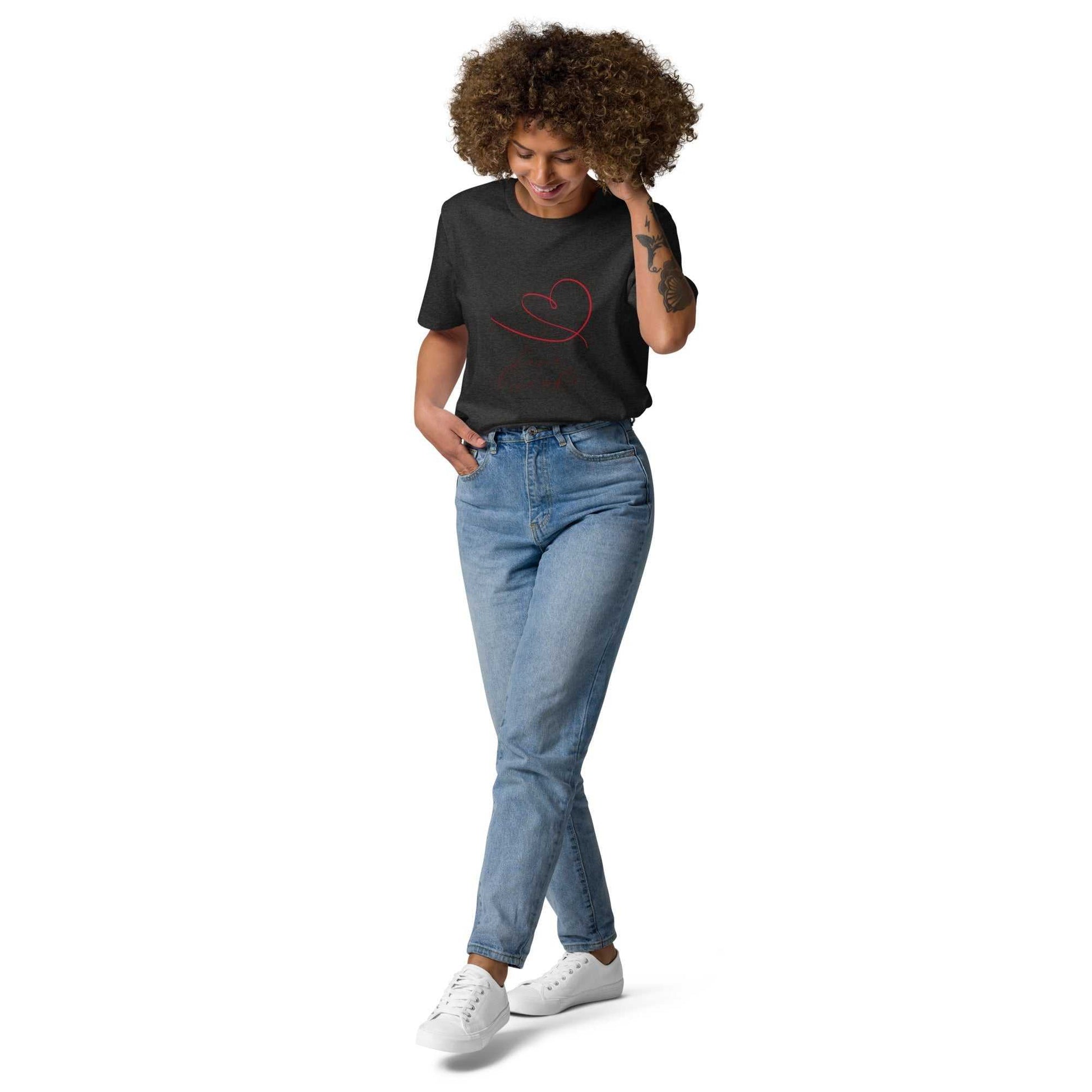 Model wearing dark heather Love Friends t-shirt in organic cotton with red heart. Eco-conscious unisex tee styled for casual sustainable fashion.