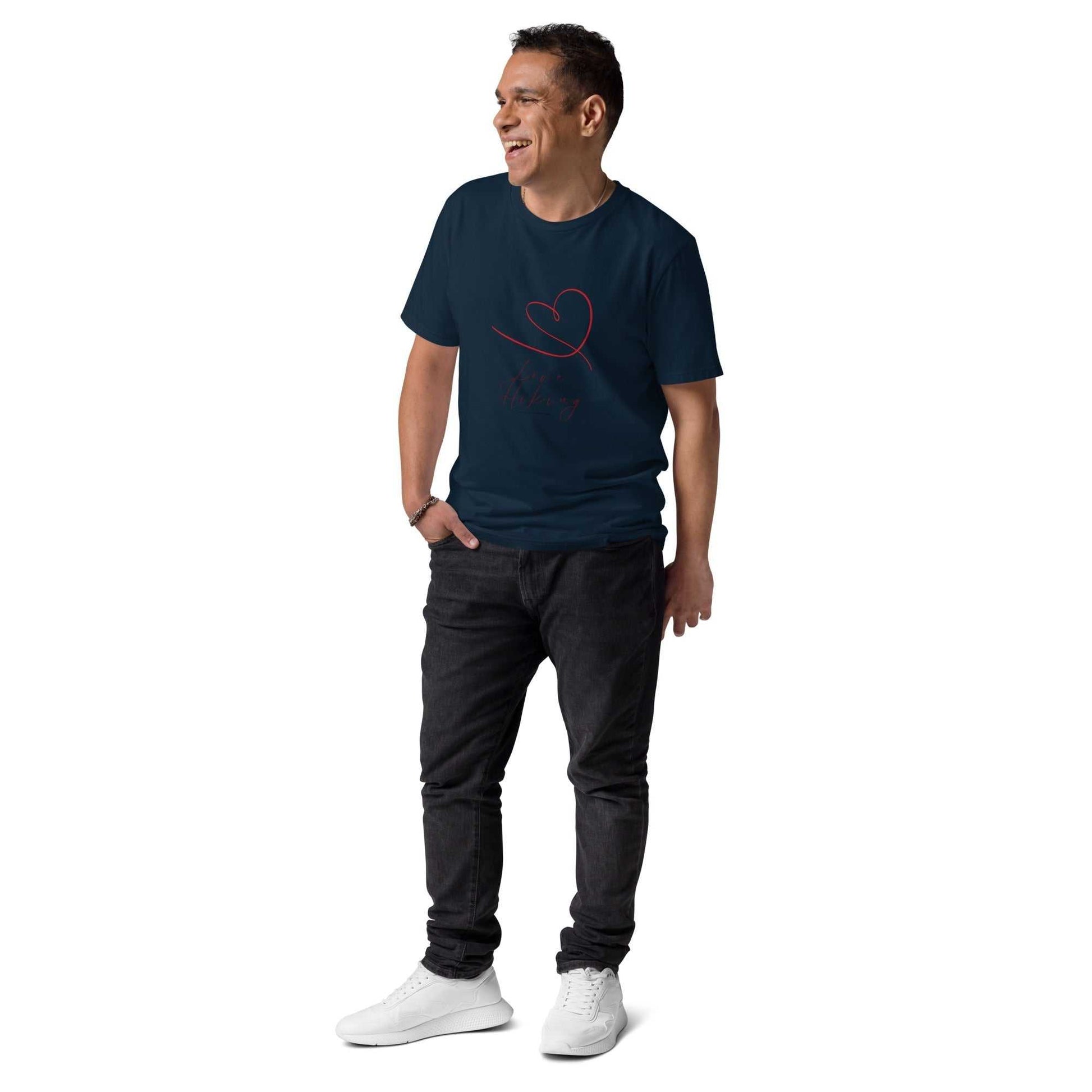 Navy blue Love Hiking organic cotton t-shirt worn by man in casual style. Eco-conscious fashion for outdoor enthusiasts.