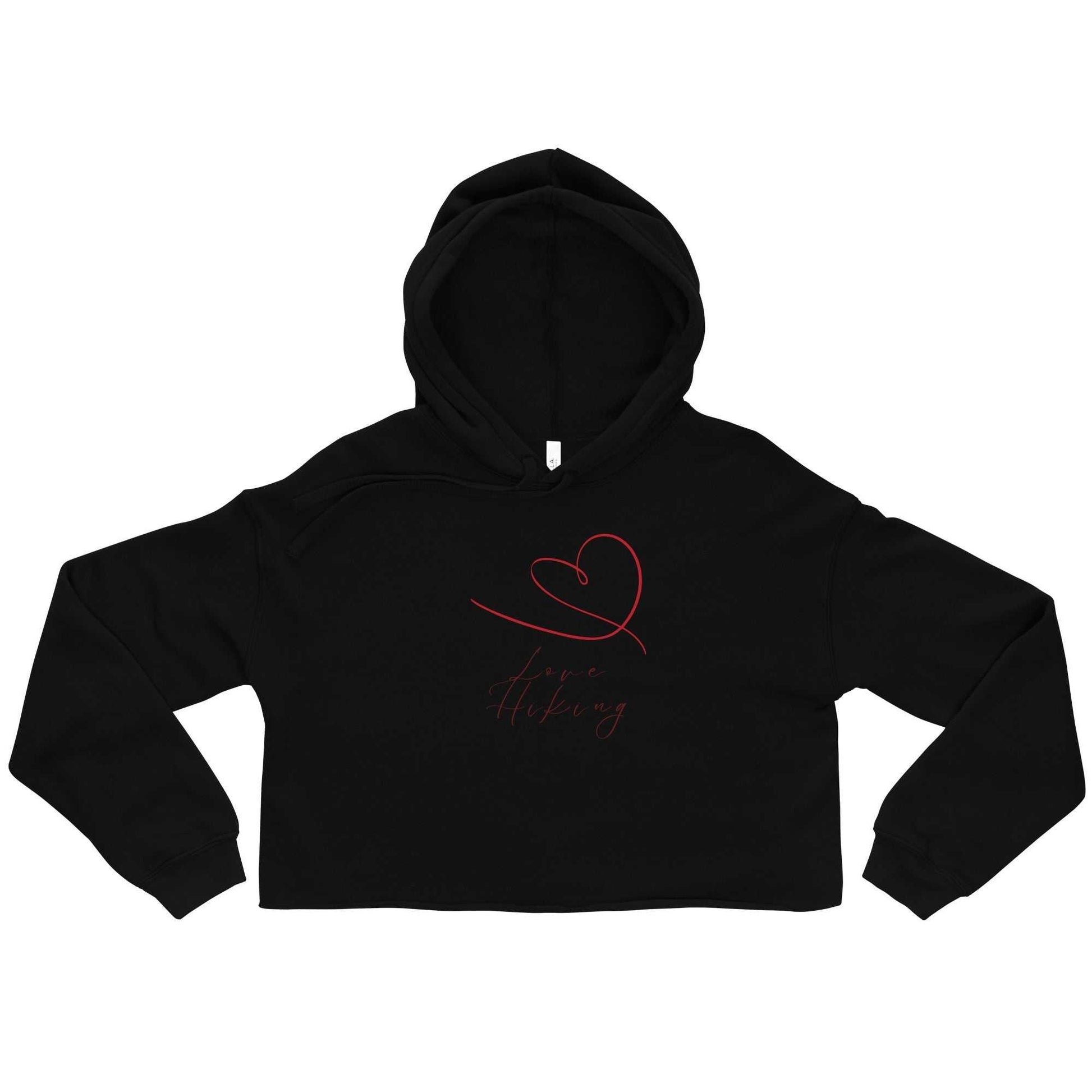Flat lay of black Valentine's Cropped Hoodie - Love Hiking Collection with red heart and script design on front.