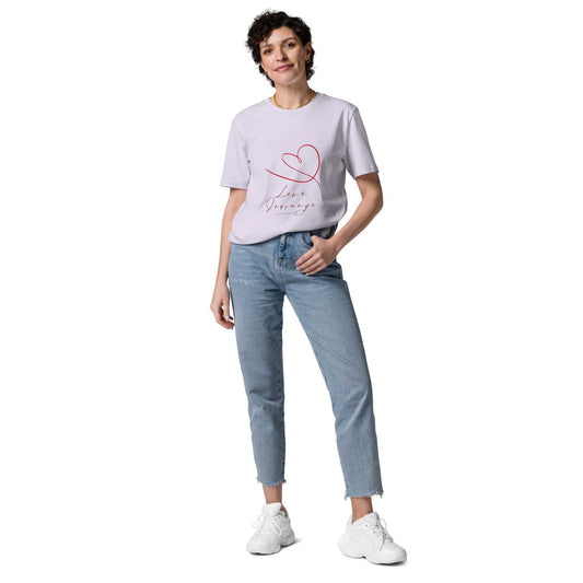 Love Journeys unisex organic cotton t-shirt in light lavender, worn by model with jeans. Features red heart and script design.