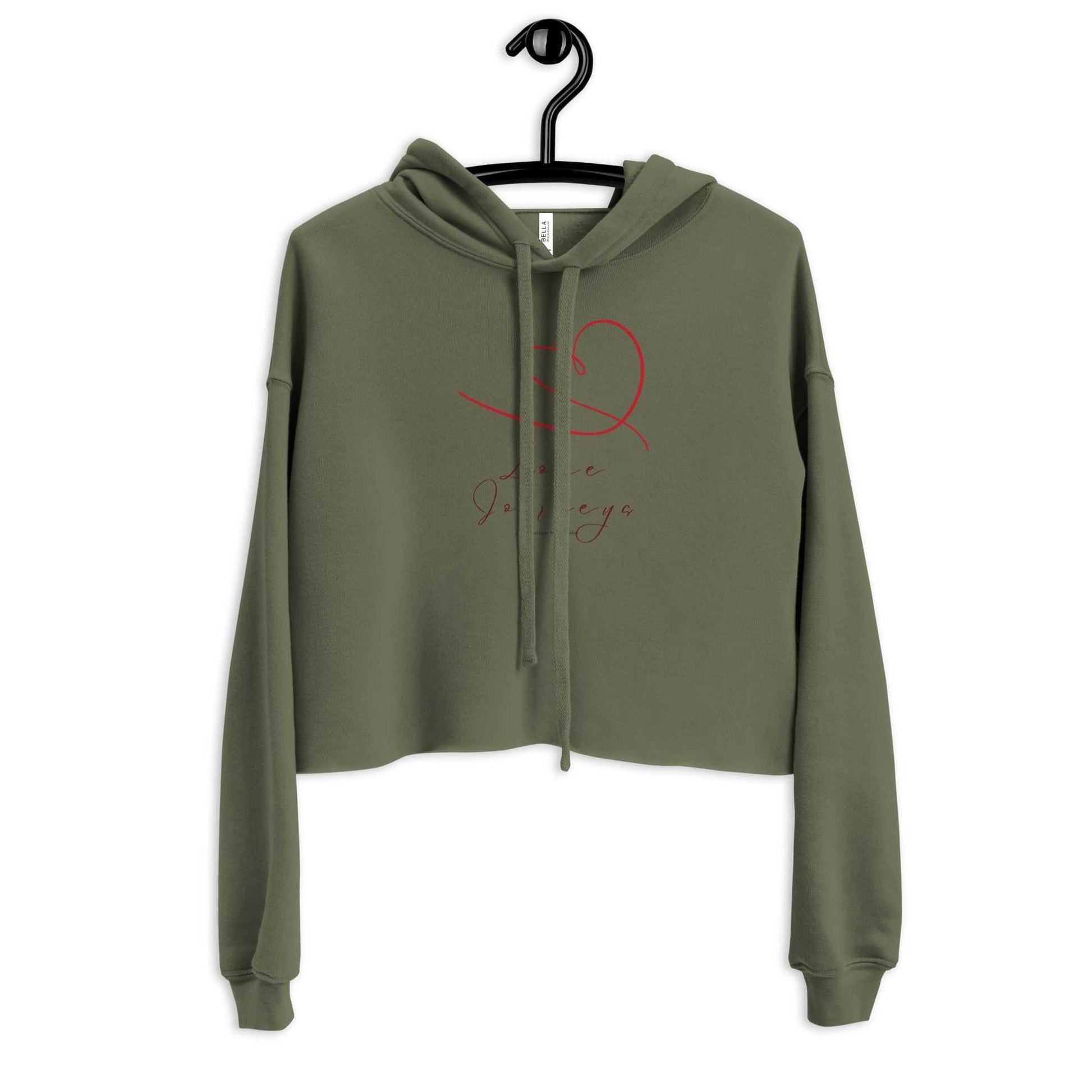 Olive green womens cropped hoodie with love design, hand-drawn red heart and script text, displayed on hanger for product showcase.