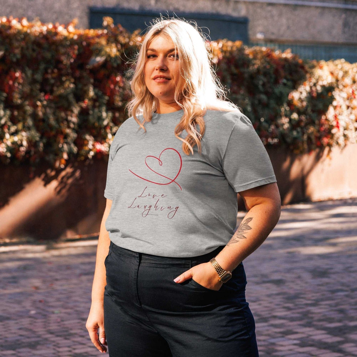 Heather gray Love Laughing T-Shirt made from organic cotton, unisex fit with red heart design for sustainable style.