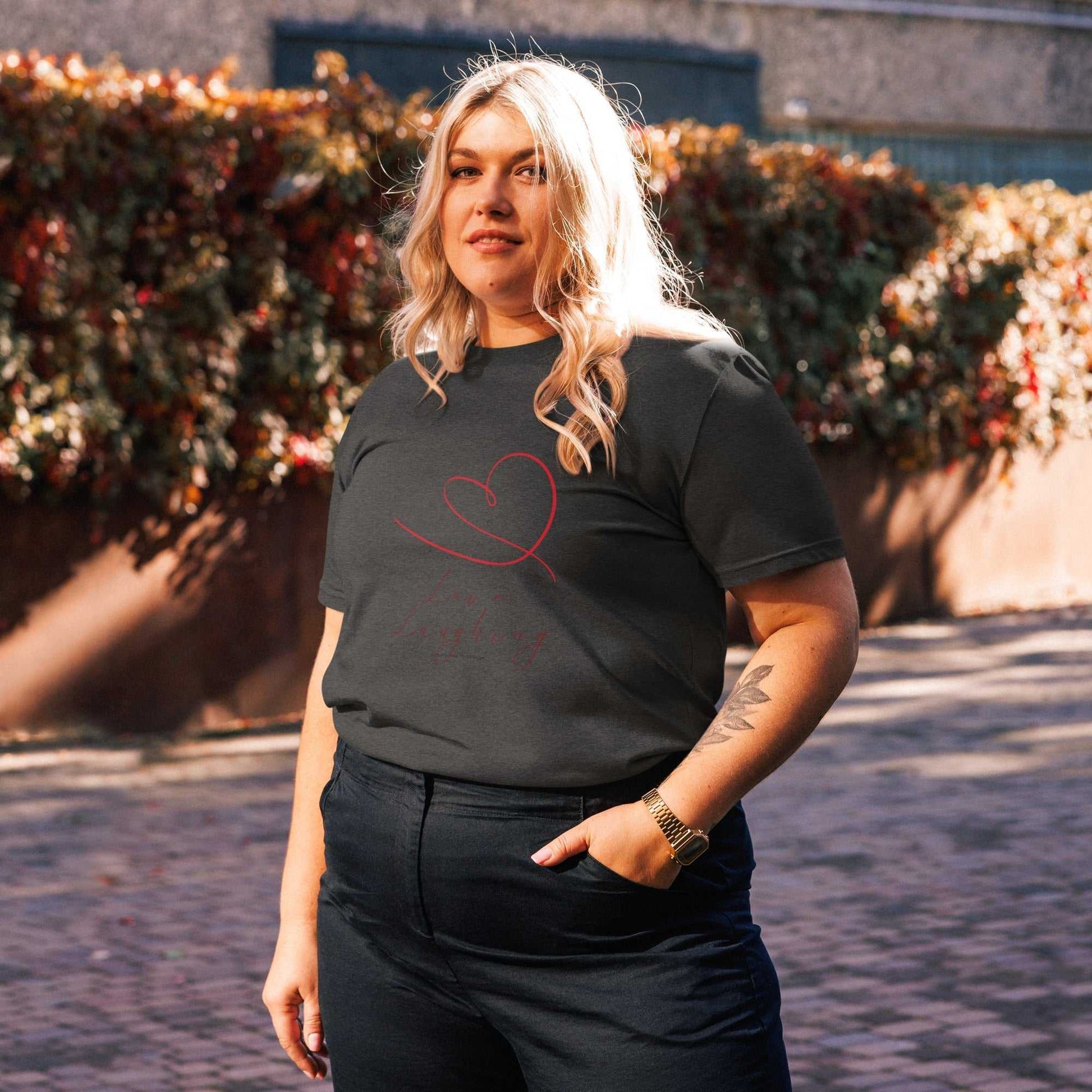 Dark heather Love Laughing T-Shirt crafted from organic cotton, featuring red heart design and eco-friendly unisex fit.