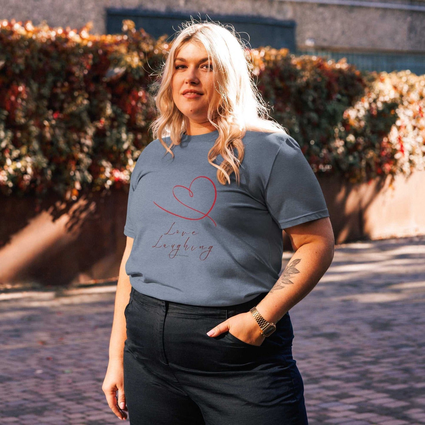 Steel blue Love Laughing T-Shirt in organic cotton, unisex fit with heart and script print for eco-conscious daily wear.