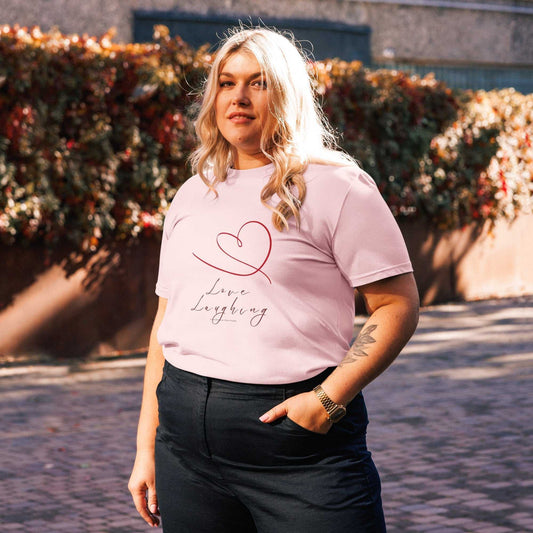Love Laughing T-Shirt in light pink organic cotton with heart design, unisex fit for eco-conscious fashion lovers.